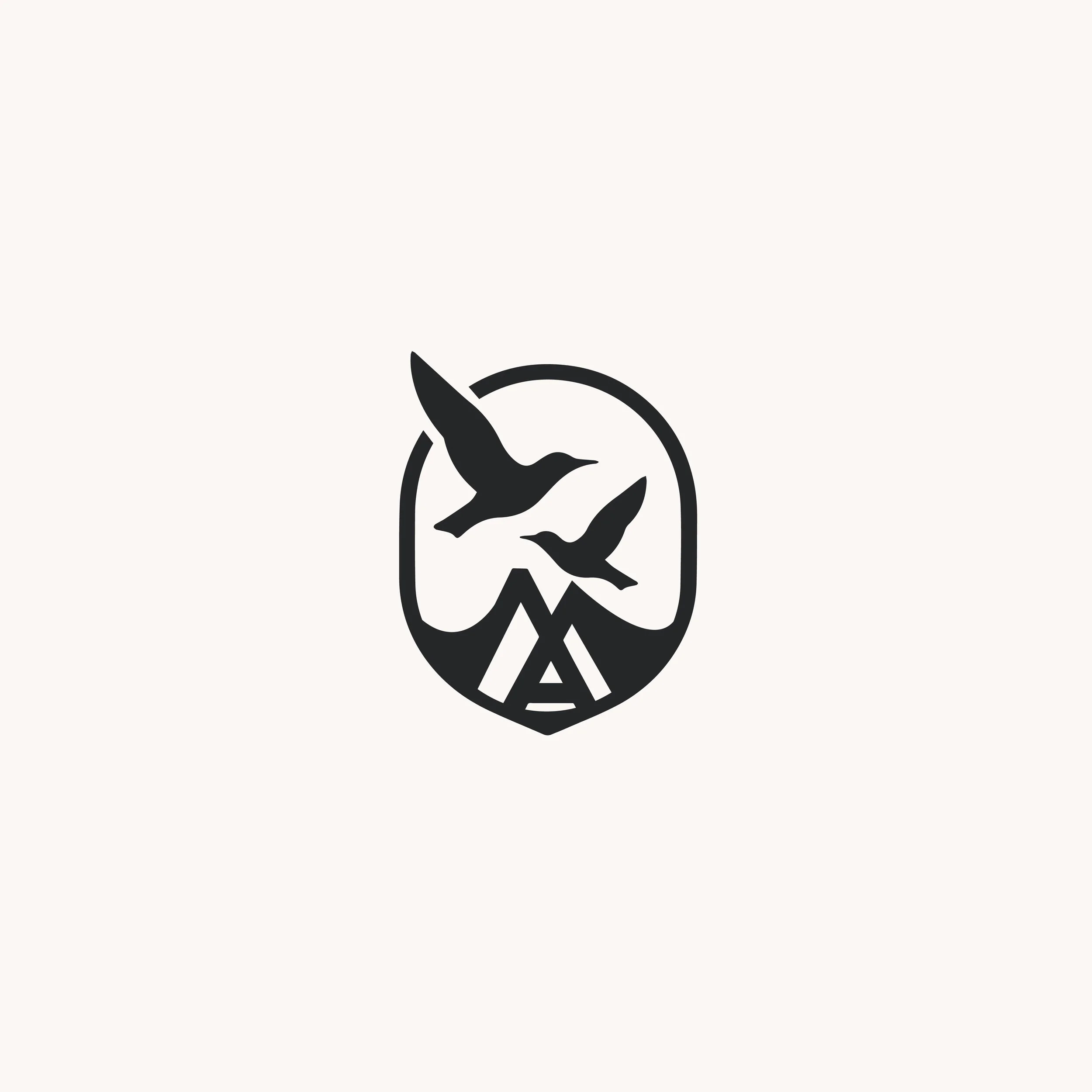 Black and white logo with two flying birds above mountains and a tent inside a shield outline.