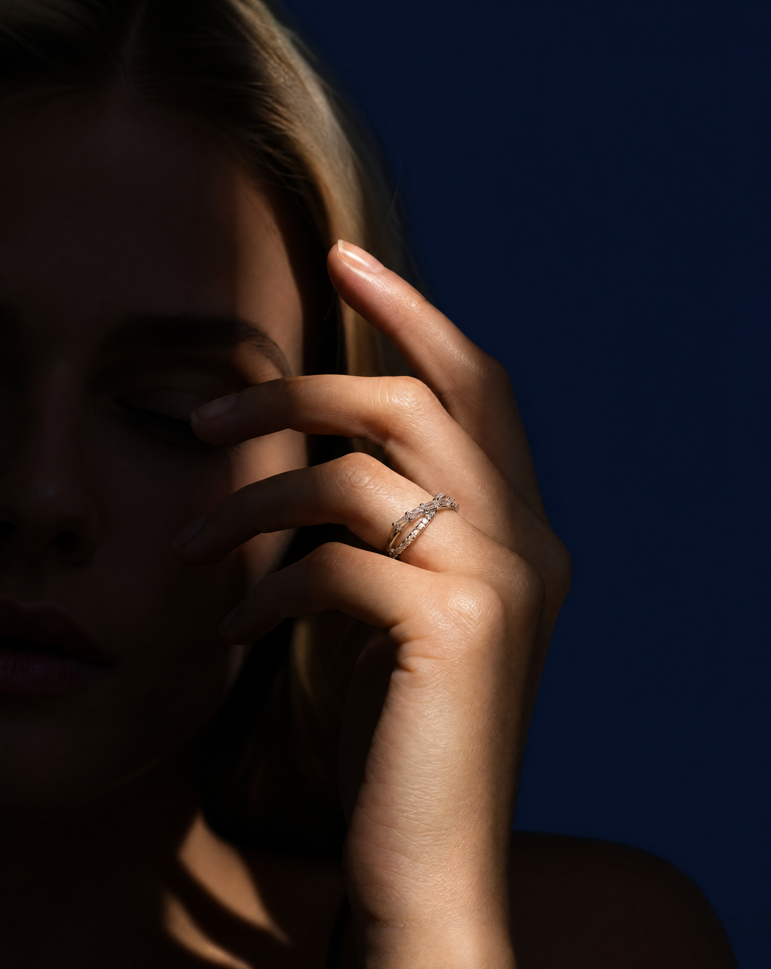 Generated with Kive.ai - Global rules (included in each prompt already) Ultra-photorealistic fashion editorial studio photo Blonde model_ face not clearly visible (shadow covers eyes upper face) Strong sunlight beam + hard shadow pattern (c.png