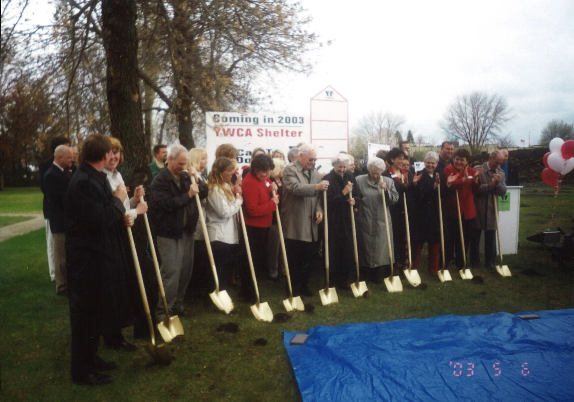 Group of people with gold shovels at groundbreaking ceremony