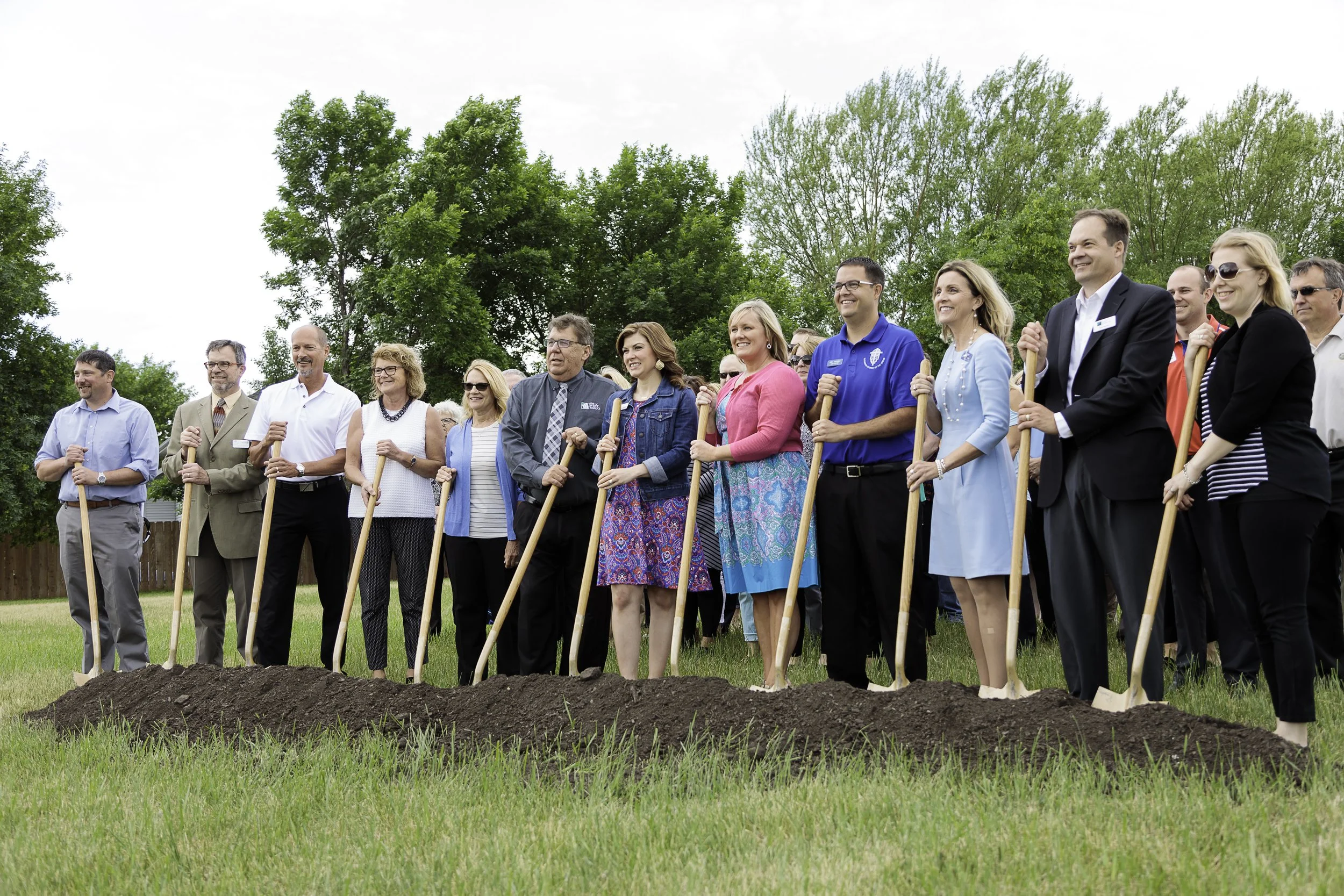 Group of people with golden shovels