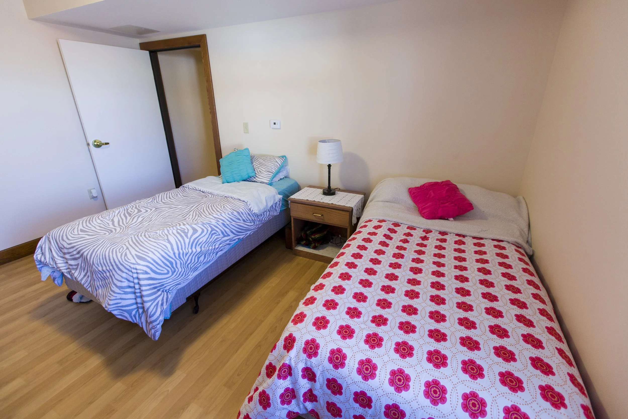 Two twin beds in tan room