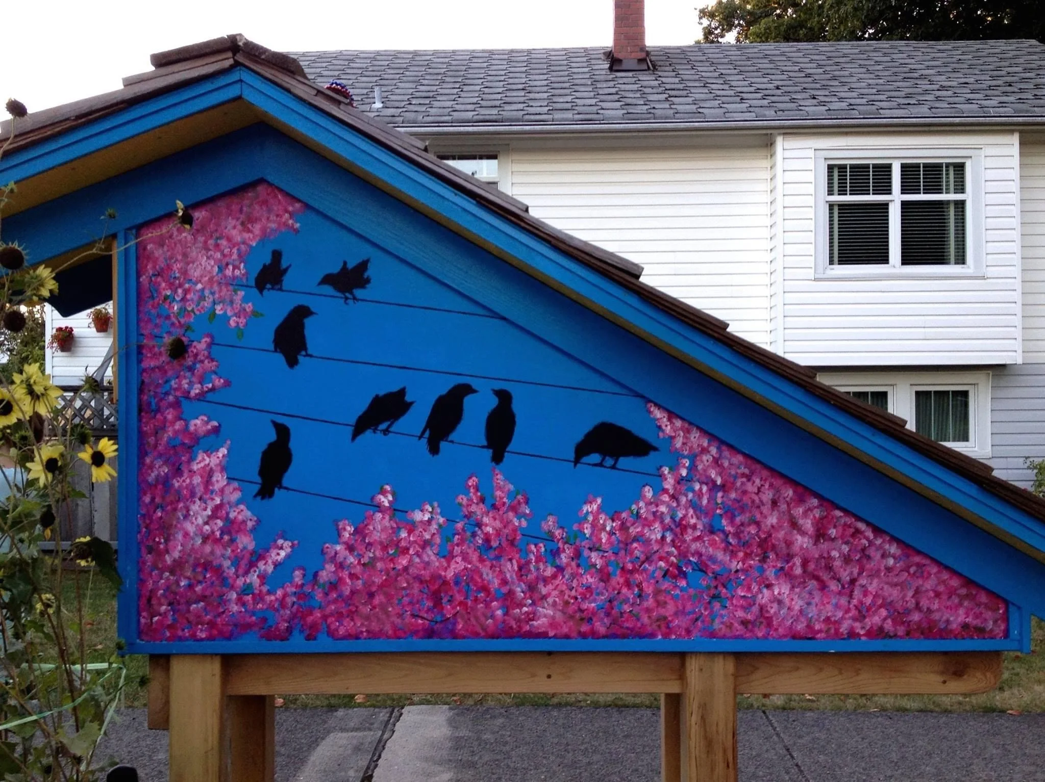 Little Library built by neighbours and funded by a Neighbourhood Small Grant from the Vancouver Foundation. I painted the mural on the back.