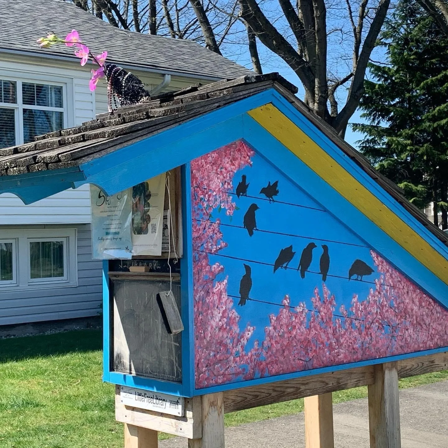 Little Library built by neighbours and funded by a Neighbourhood Small Grant from the Vancouver Foundation. I painted the mural on the back.