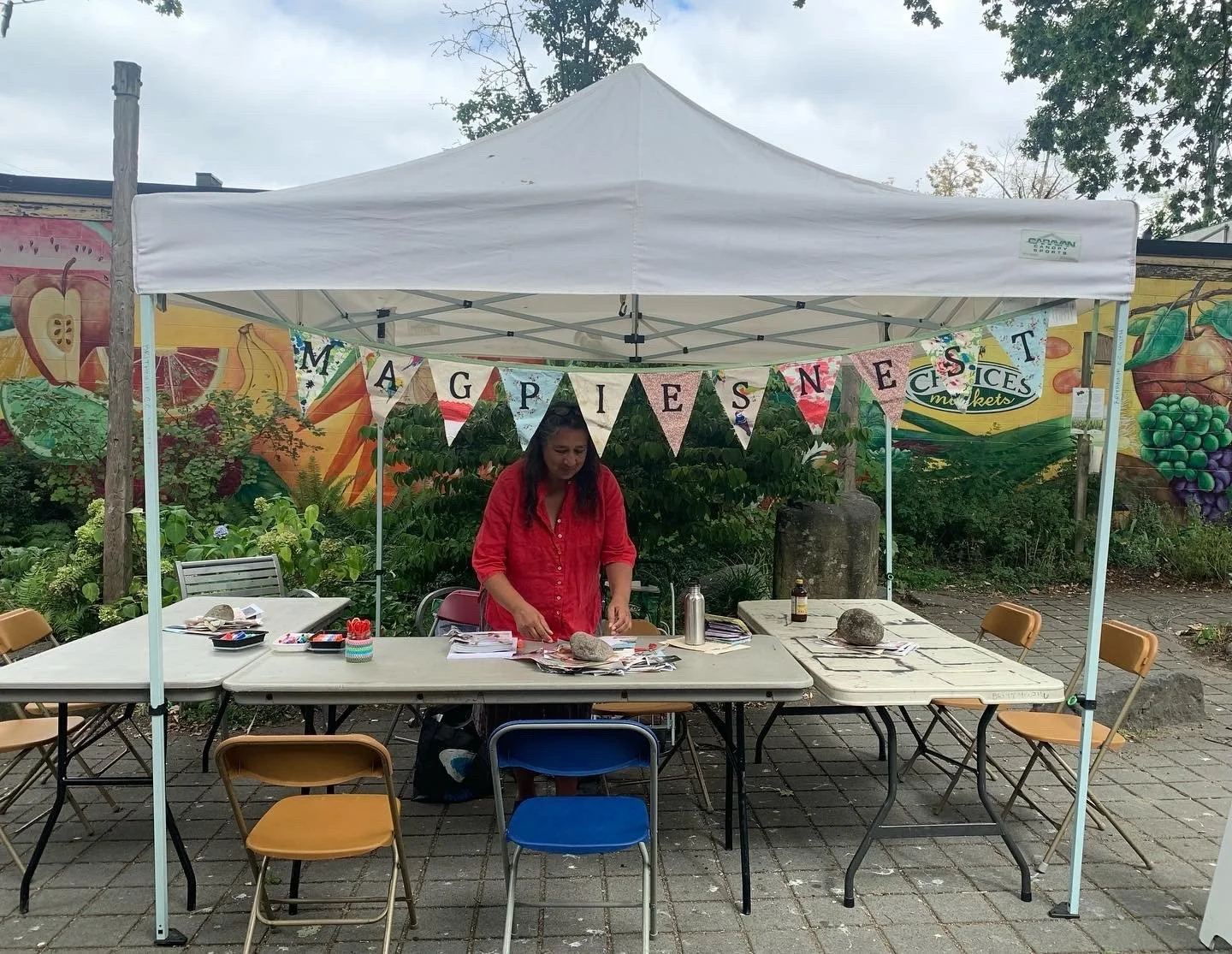 Magpie's Nest summer workshop at the Britannia Plaza Festival Market, making mini-zines with Dada found poetry. This is my friend and co-Magpie, Dawn Livera.