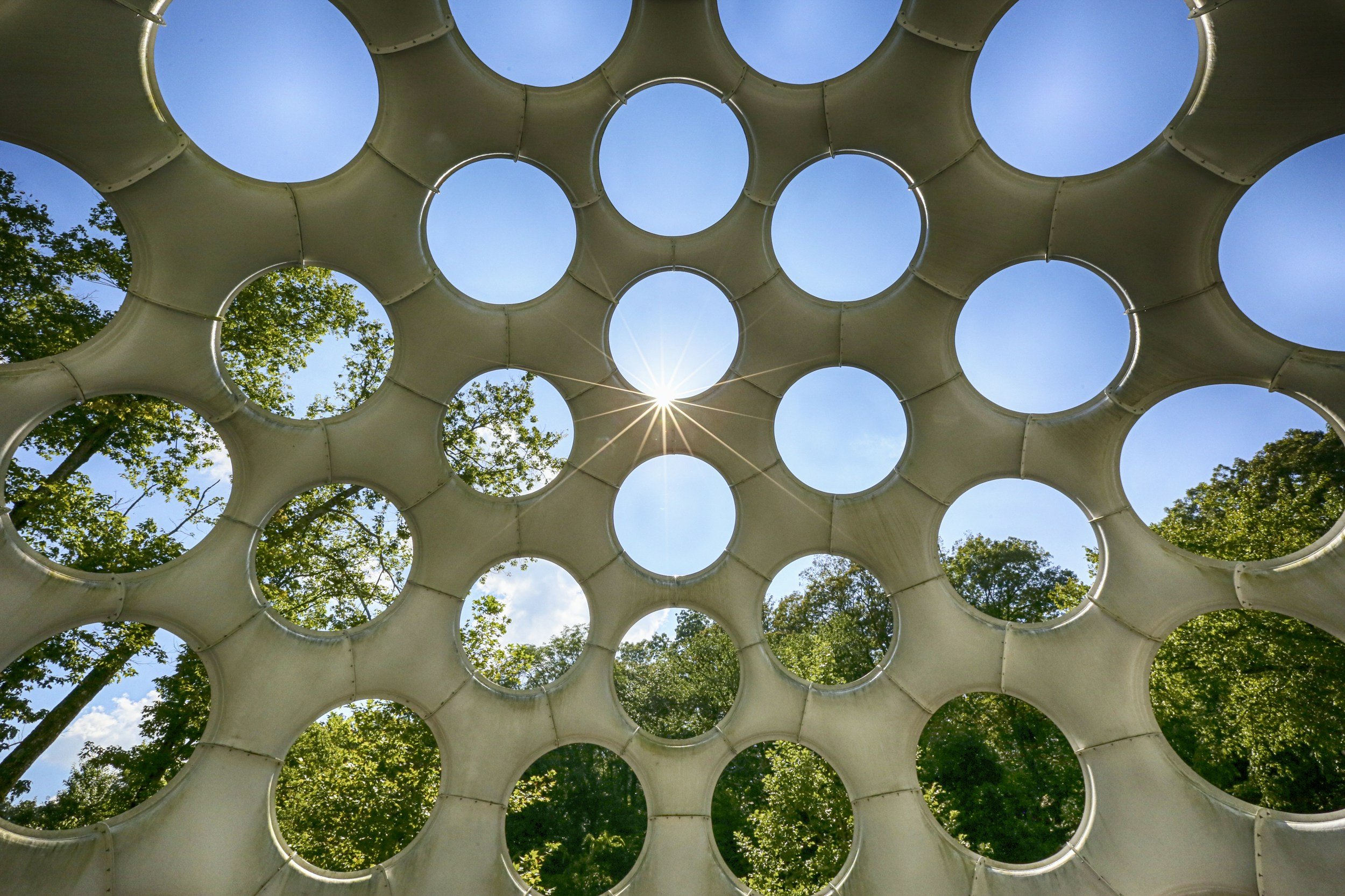 Image of sun shining through a building with holes. If you struggle with regulating your emotions, work with a skilled somatic therapist in Pasadena, CA to help you begin healing.