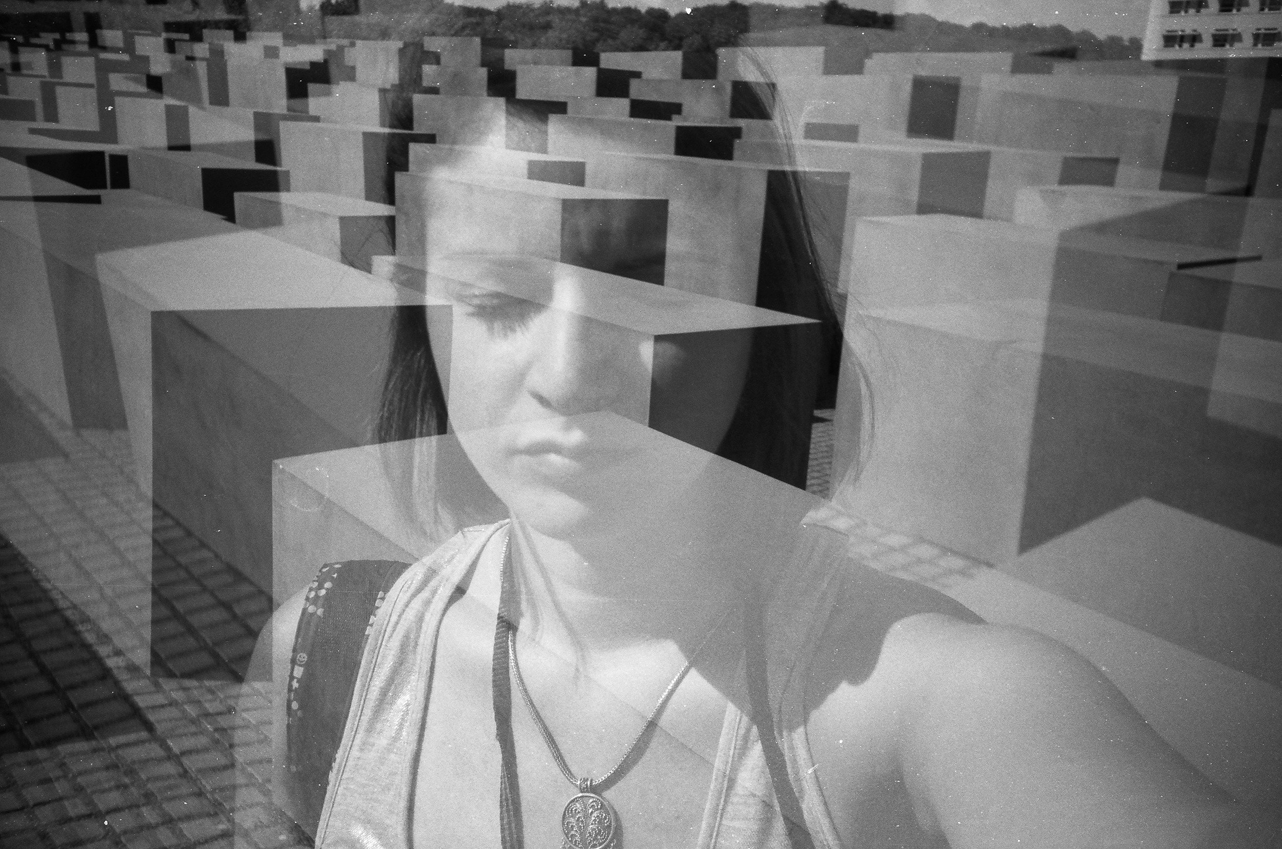 Image of a woman with her eyes closed with blocks. Begin healing from your past trauma with the help of somatic therapy in Pasadena, CA.
