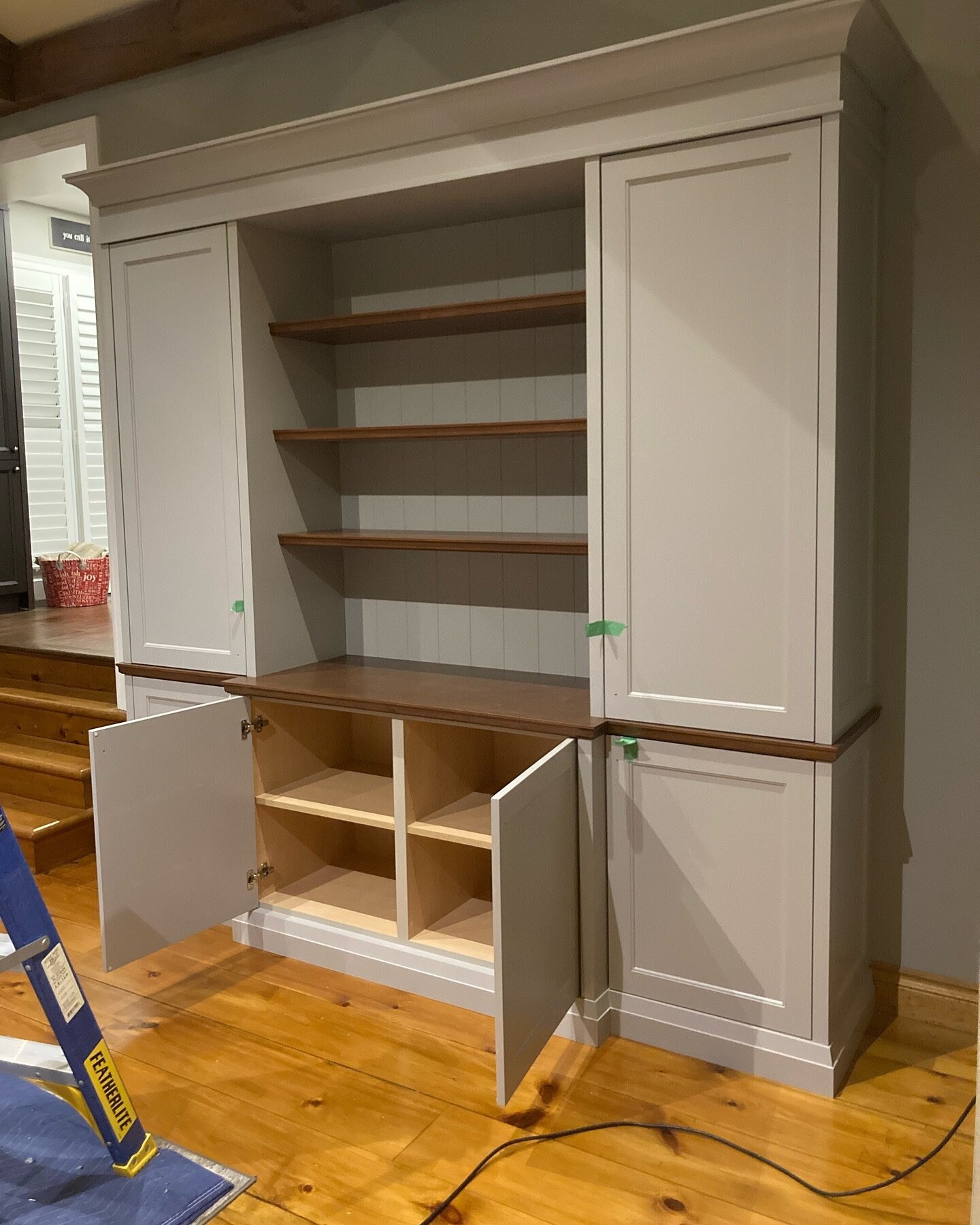 Finishing touches on this wall unit with a maple top, matching display shelves, and a v grooved back panel #customcabinets #wallunit #design #toronto #maple #builtin #cabinetmaking
