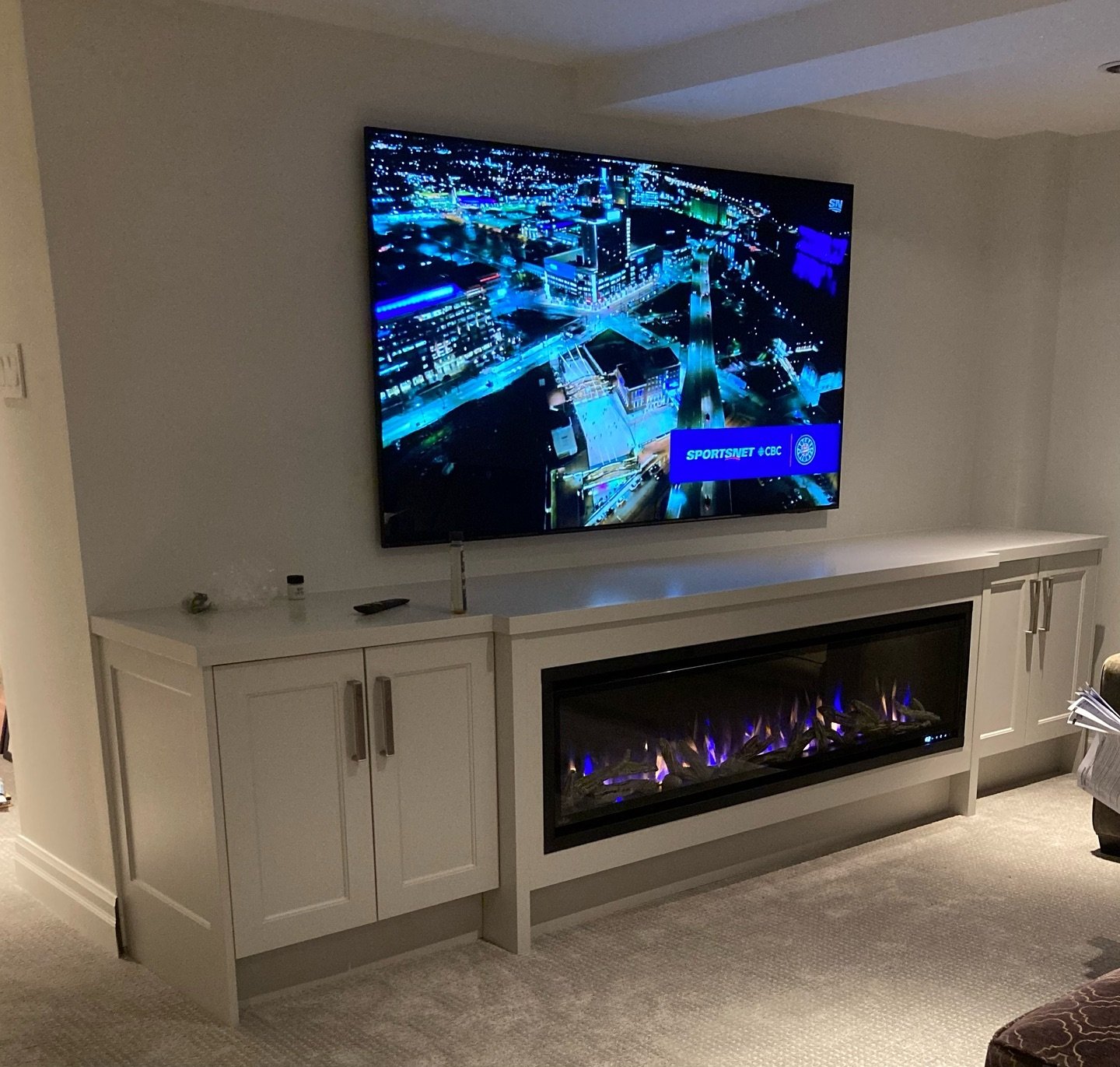 Check out this entertainment unit we recently completed with a stepped built-in fireplace. Perfect spot to cozy up and watch the leafs go for the cup! 🚨🏒 #custom #entertainmentunit #fireplace #builtin #millwork #millworkdesign
