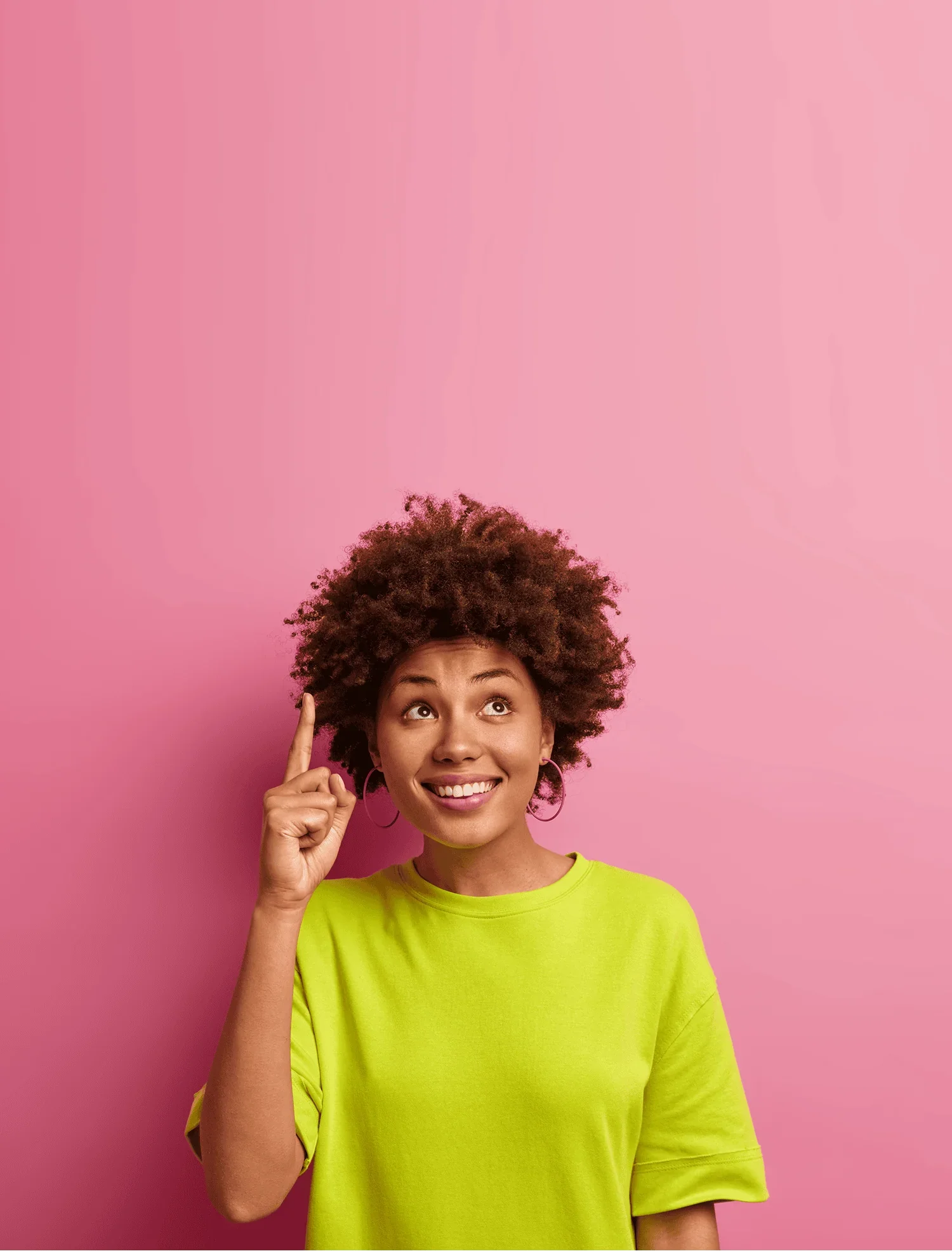 woman in yellow t-shirt against pink background sharing a business idea