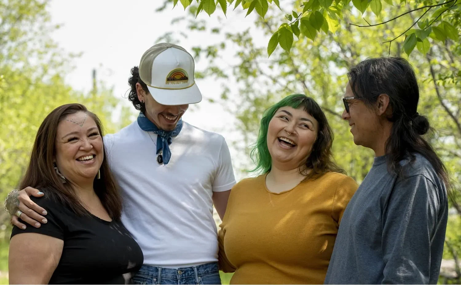four Indigenous entrepreneurs laughing together and building community
