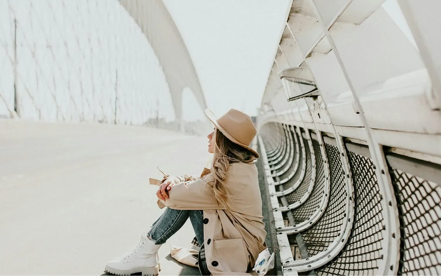 woman sitting on bridge representing early stage business program for entrepreneurs