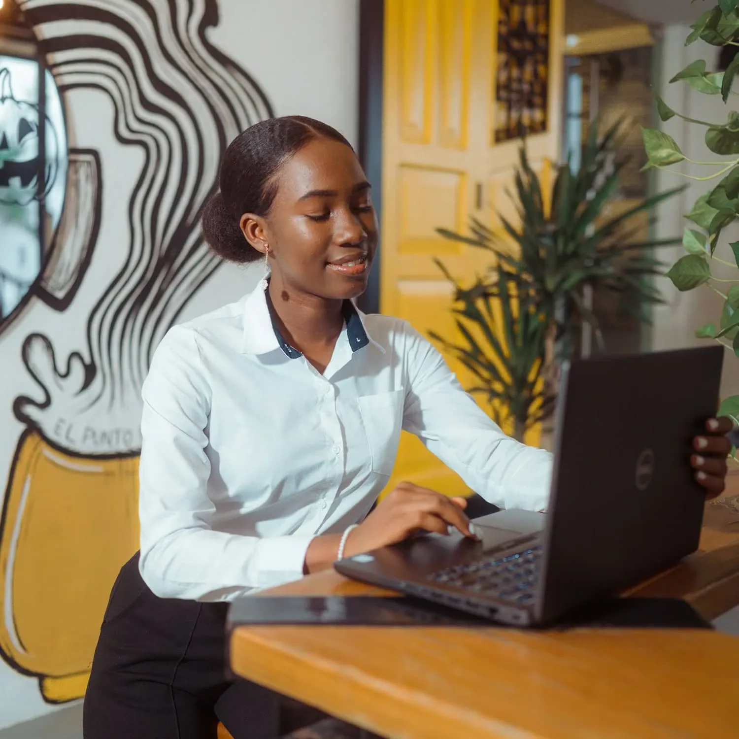 Woman working on laptop exploring career opportunities