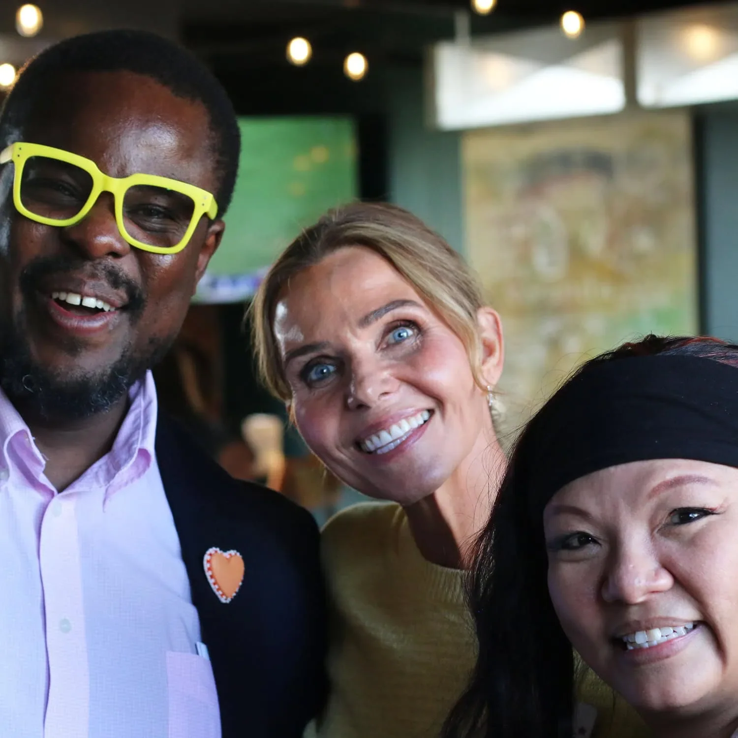 three business owners posing for a photograph during AWE Summit