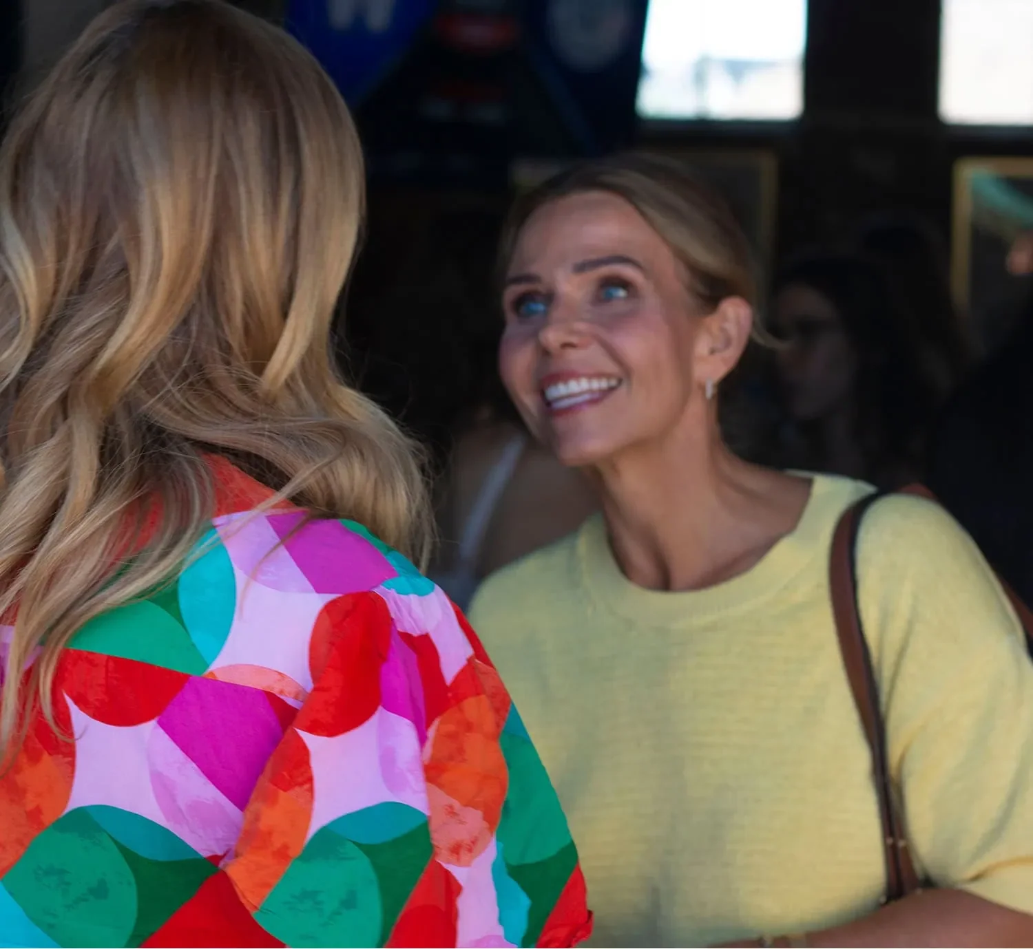 two women in animated conversation during AWE Summit