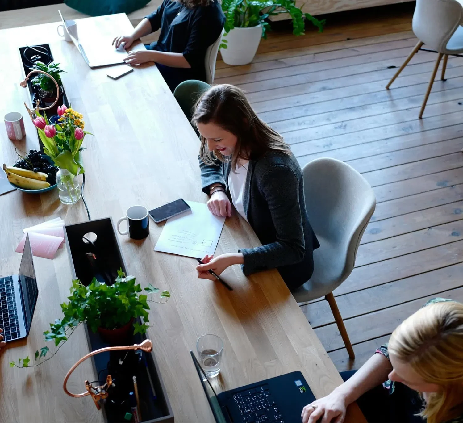 group of women using laptops during online business workshop
