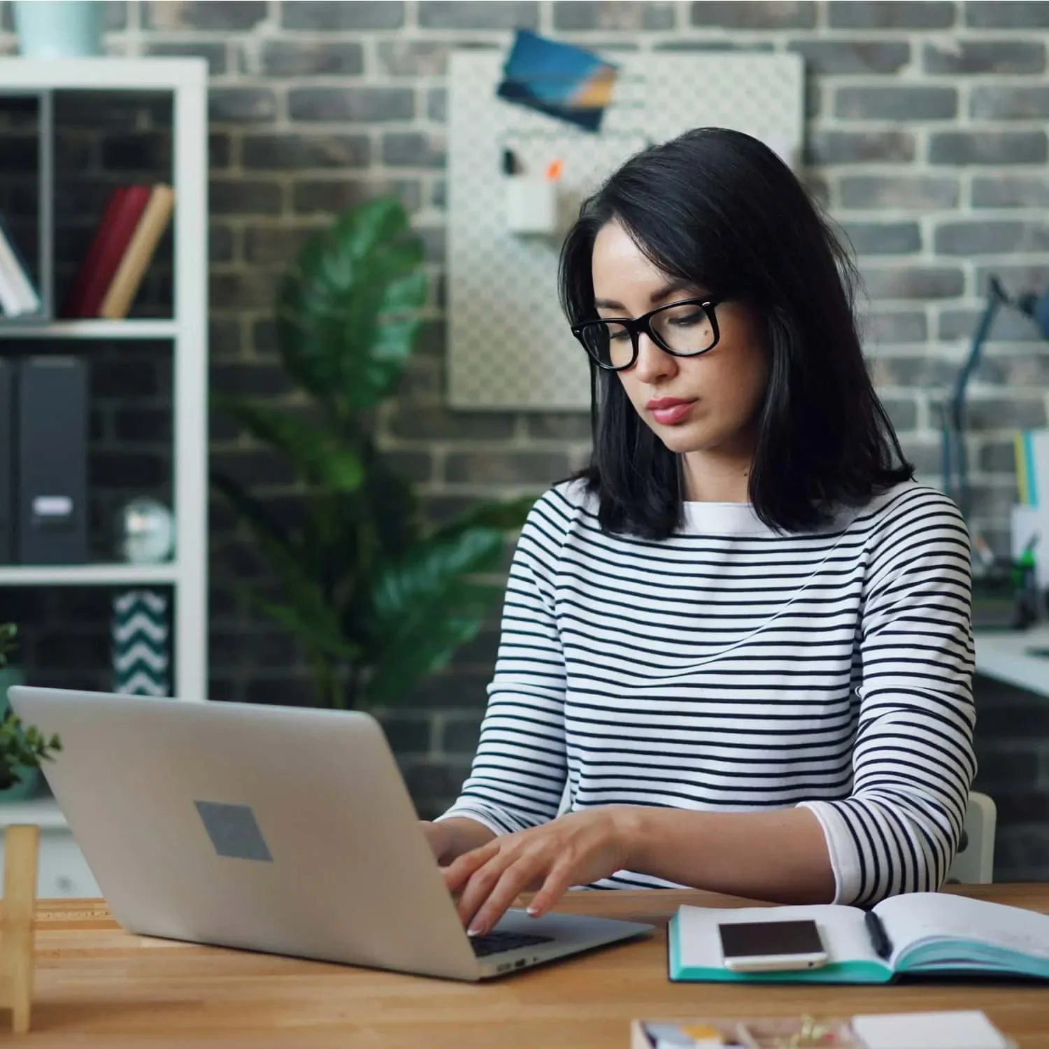 woman submitting loan application on her laptop