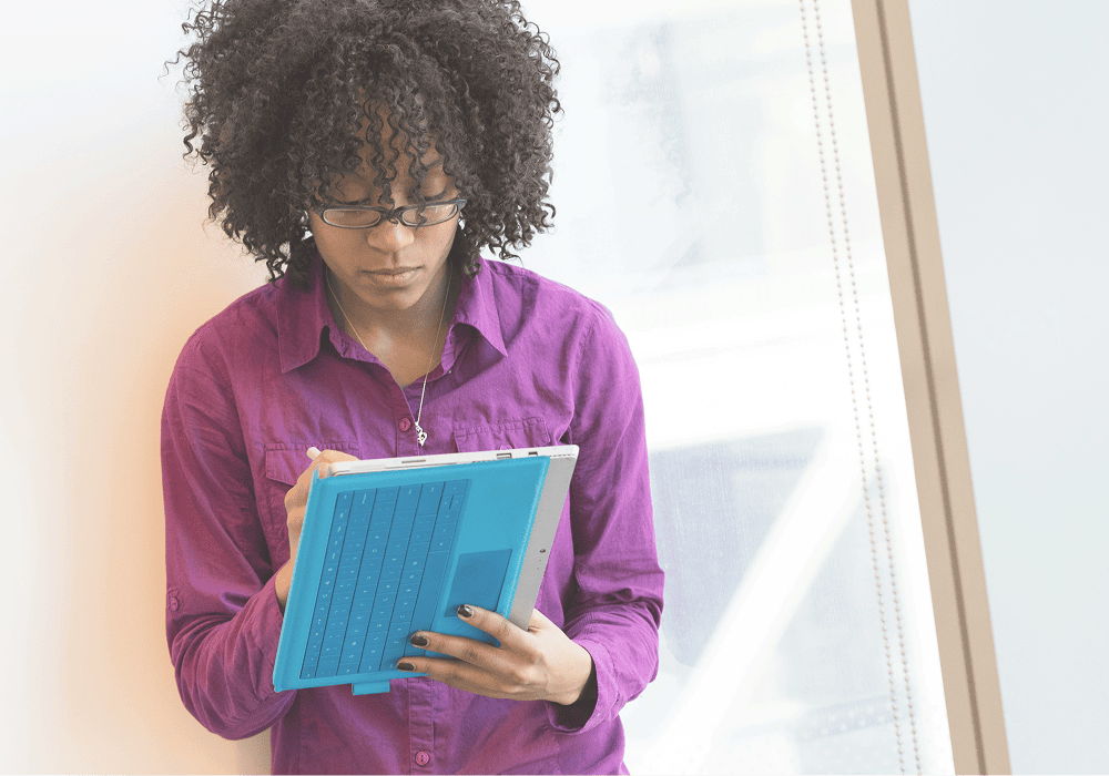 woman reviewing notes and plans representing business growth in progress