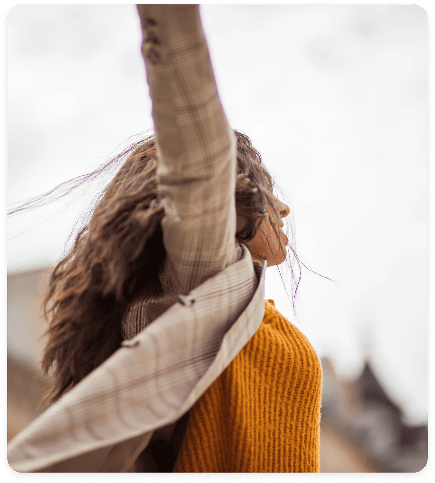 Alberta women entrepreneurs embracing confidence with woman standing arms outstretched in the wind