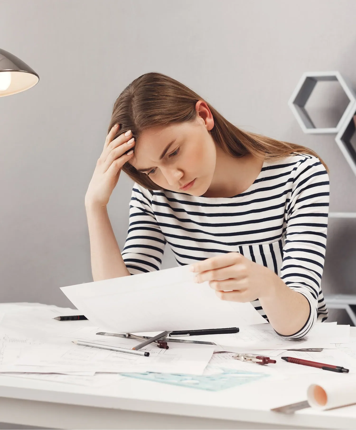 woman reviewing document while checking for errors in financing application