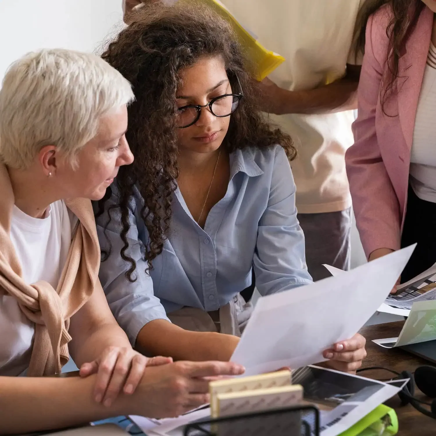 two women reviewing documents for small business grants in Alberta