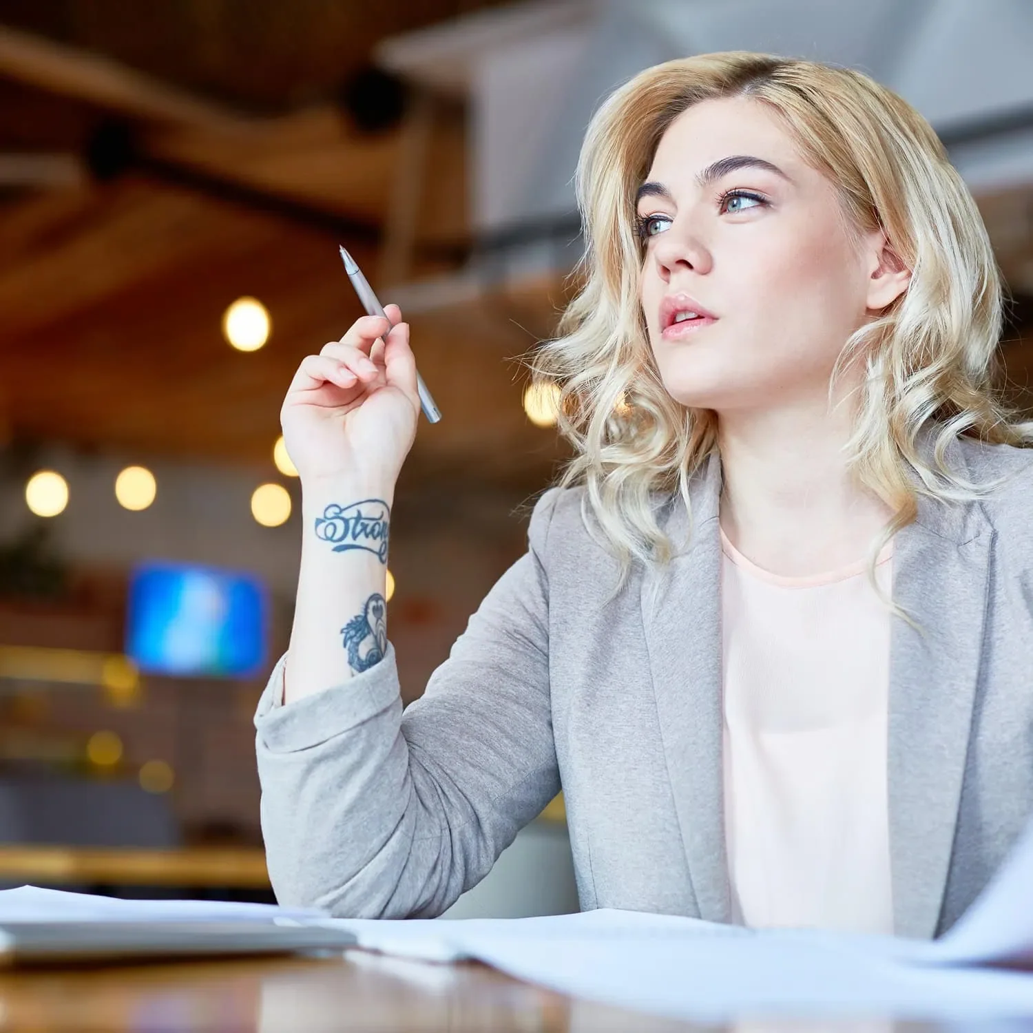woman holding pen during business learning session