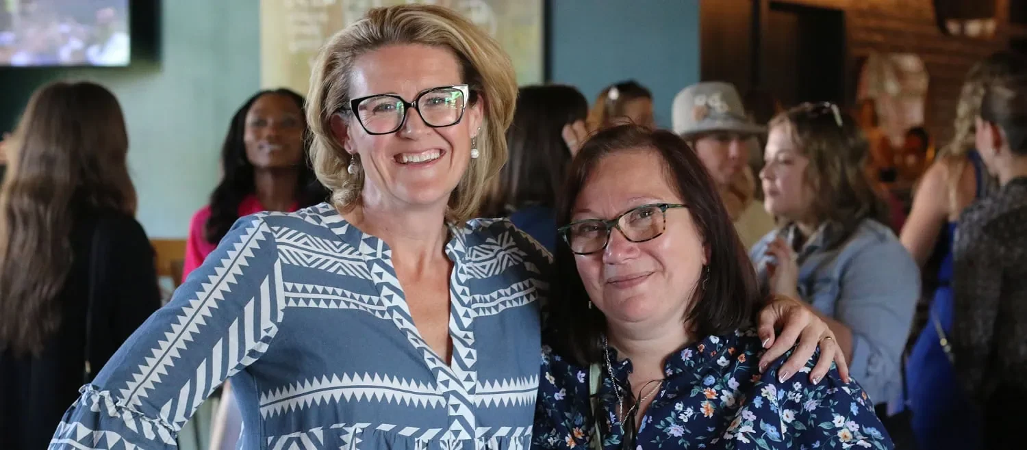 two entrepreneurs posing for photo during AWE Summit event