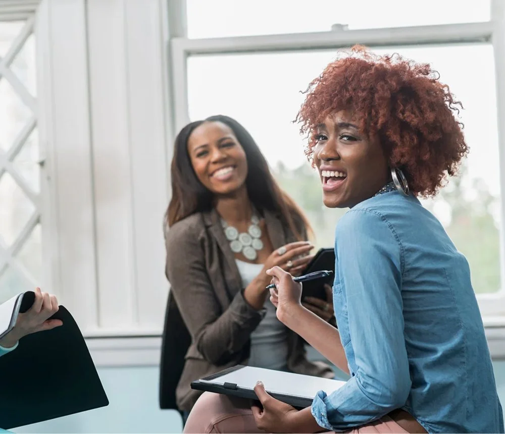 two women in conversation discussing business opportunities