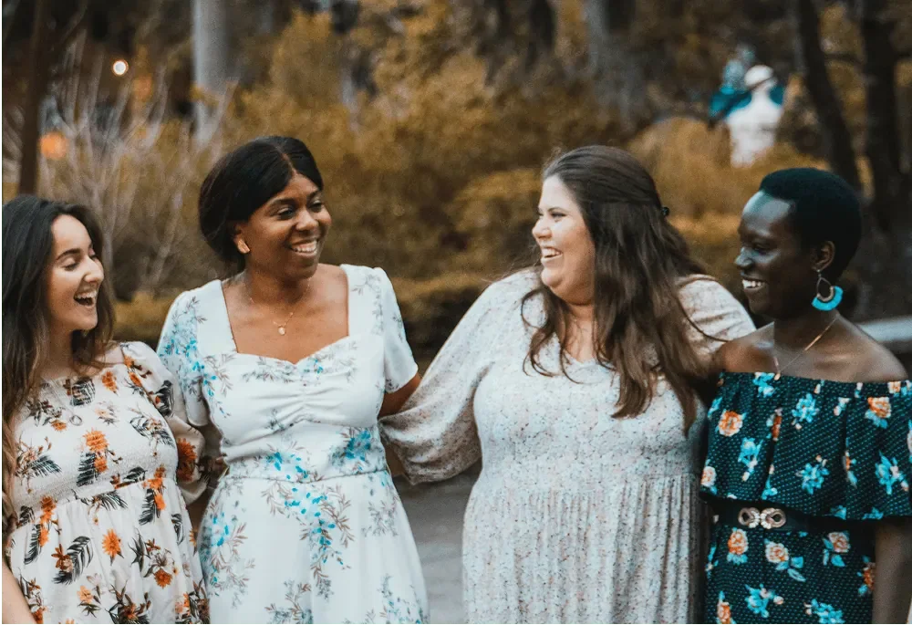 group of entrepeneurs laughing during a photoshoot