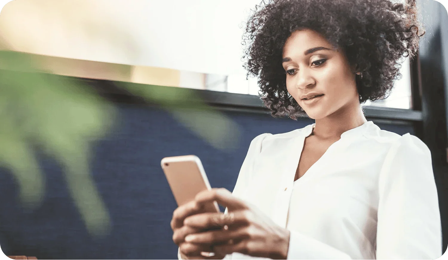 Alberta women entrepreneurs growth oriented business owner reviewing strategy on cellphone