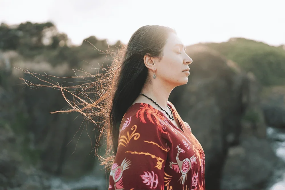 woman outdoors reflecting on early stage business planning and direction