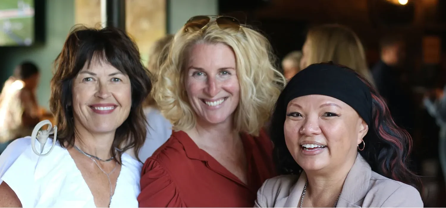 two entrepreneurs posing for photo during AWE Summit event