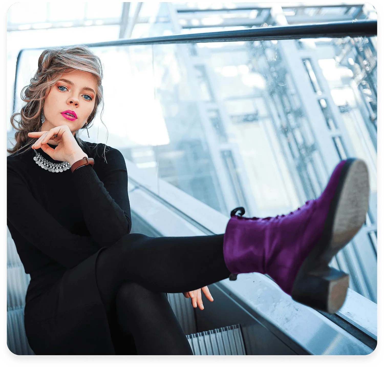 Alberta women entrepreneurs building confidence, woman with bold lipstick and purple shoes looking at camera