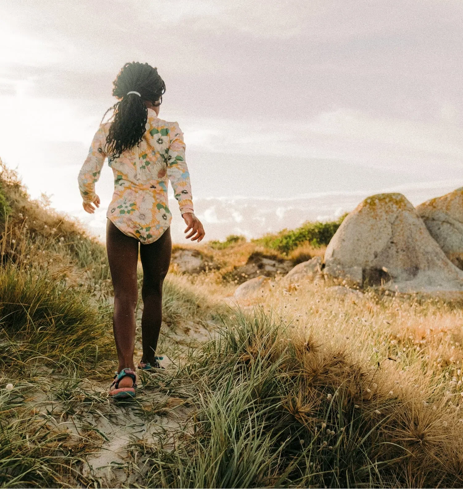 woman walking in the mountains representing independence and business ownership