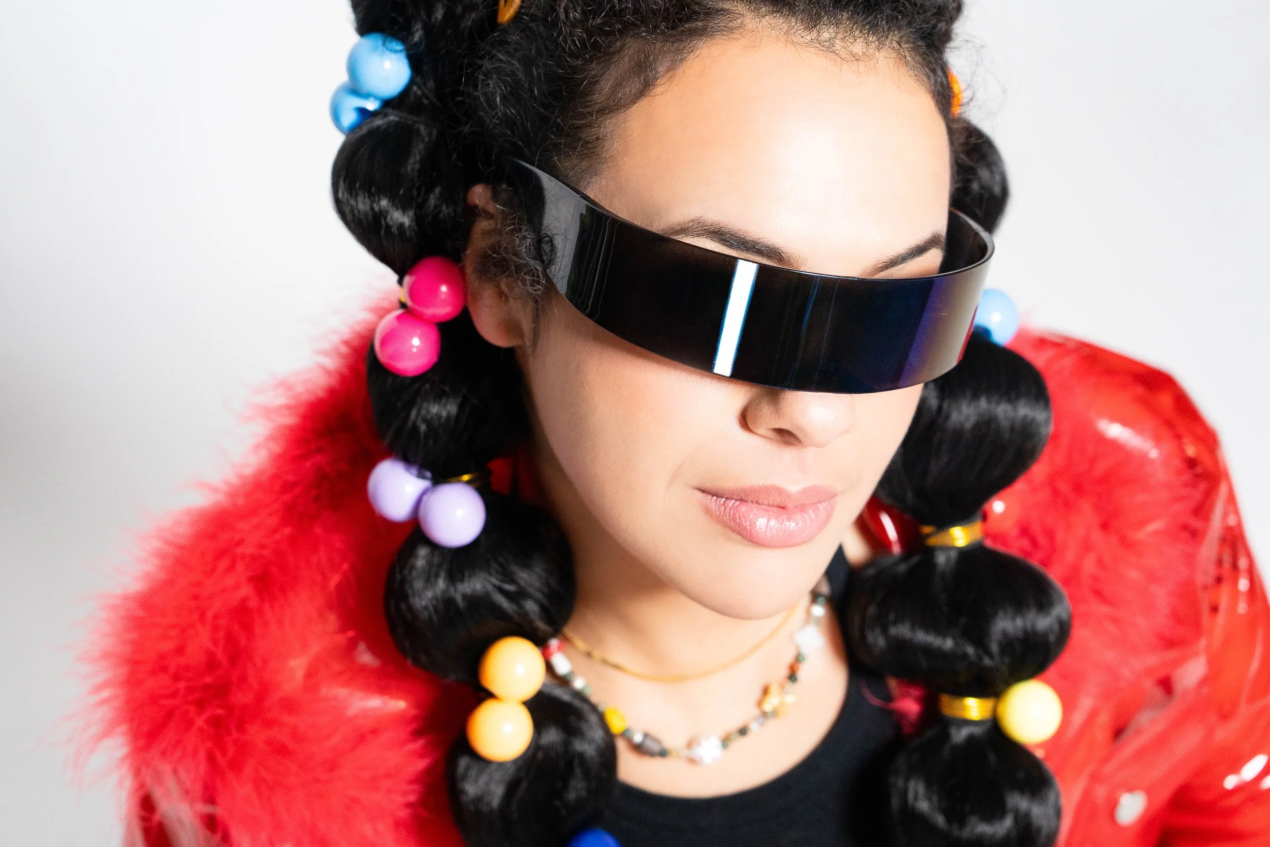 photo of woman wearing space glasses and 90s fashion by portrait playdate