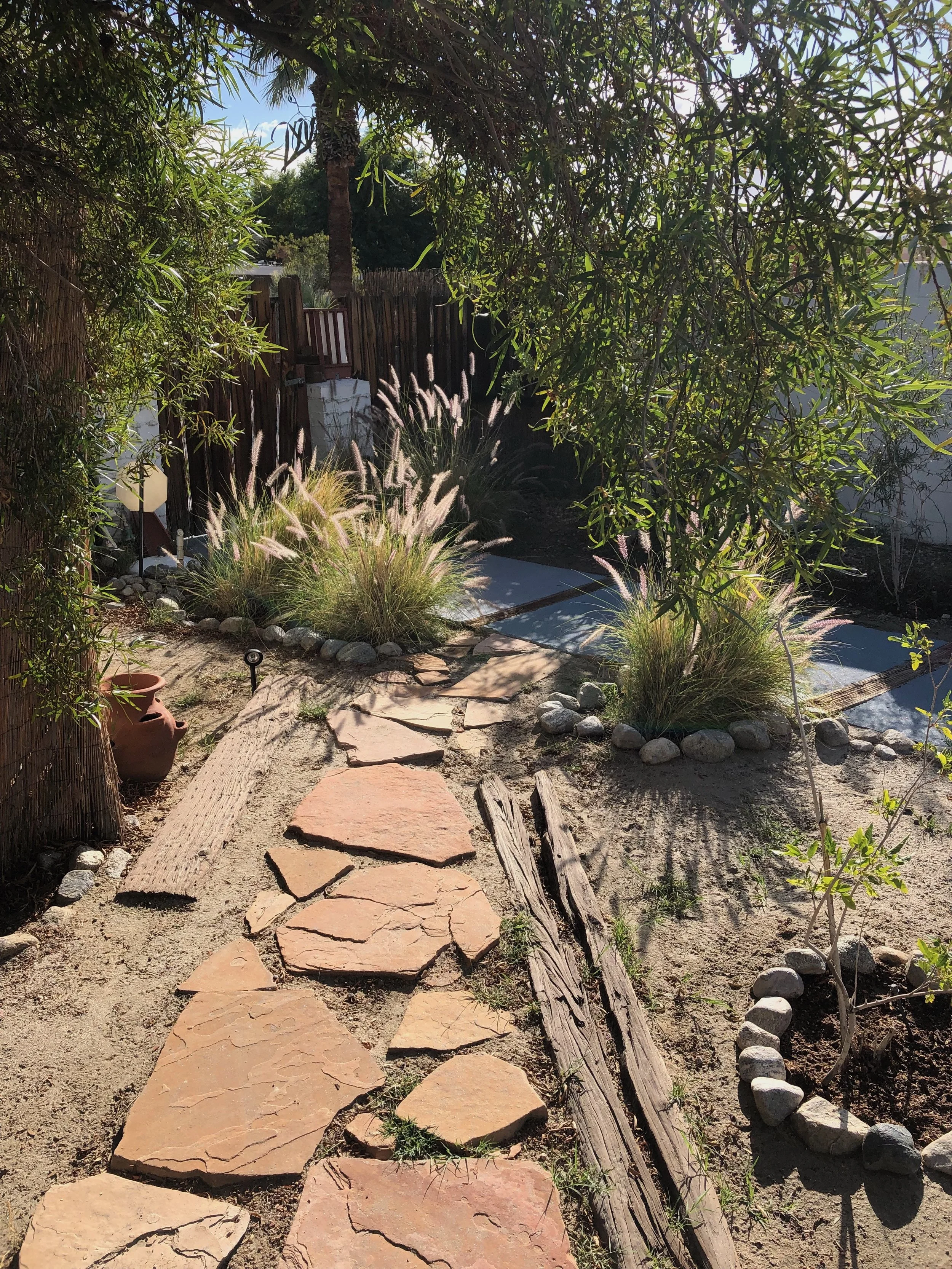 garden and stone pathway to inn from entrance gate
