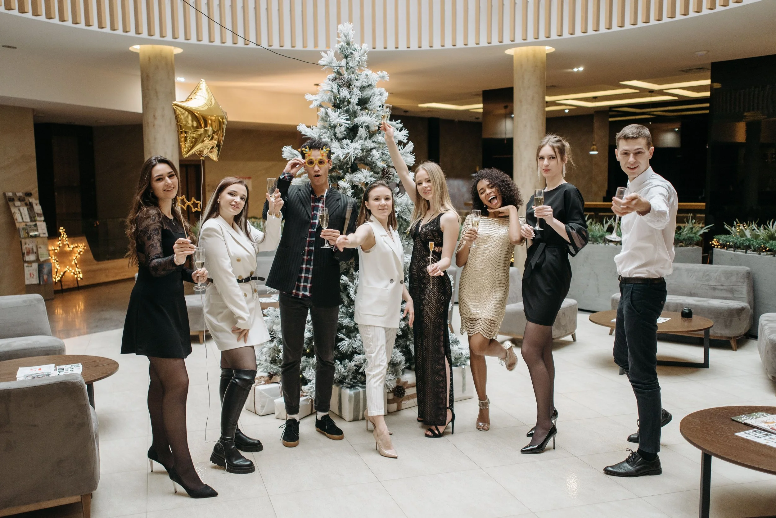 Team celebrating a company corporate holiday party with DJ Anjna