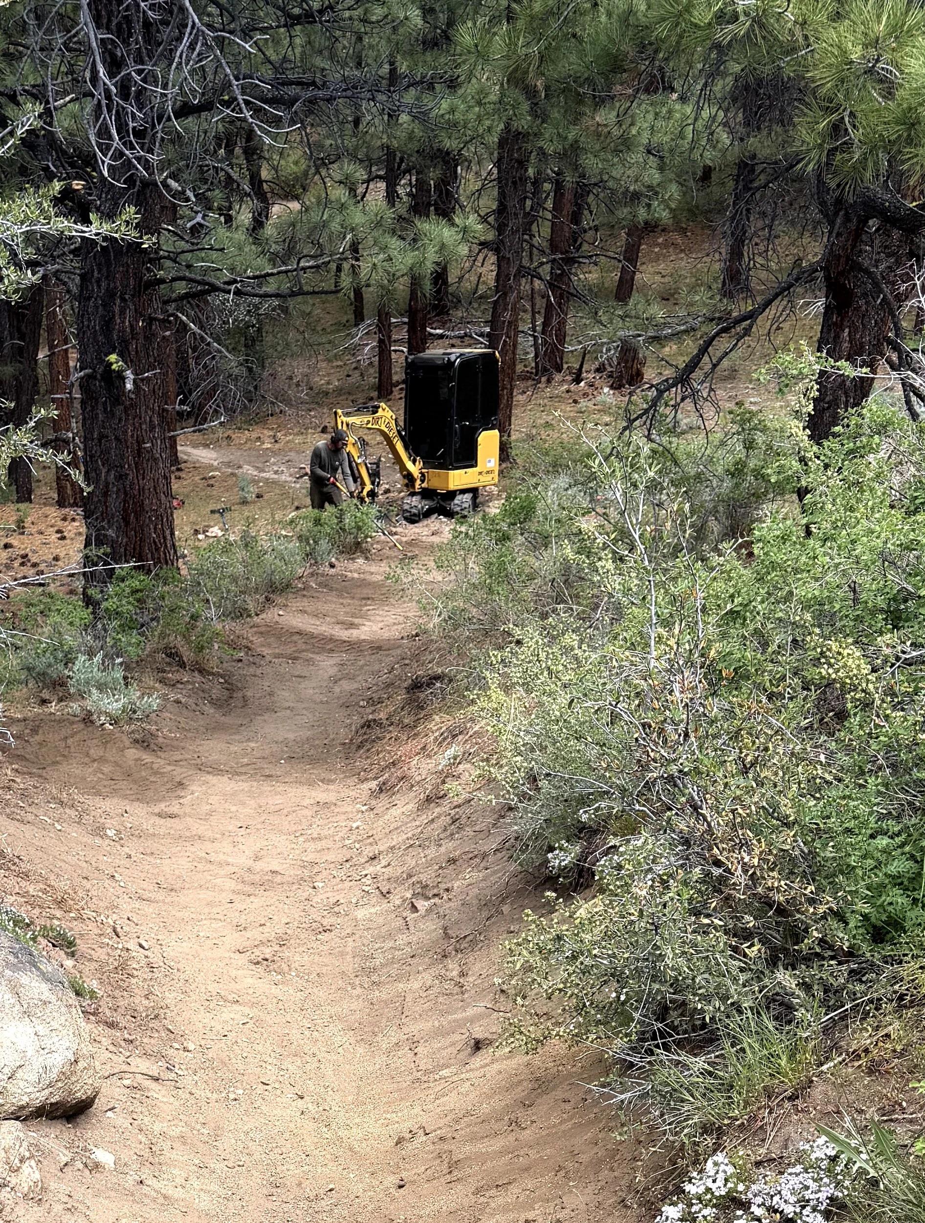 Excavator building trail in the Peavine Maze trail system