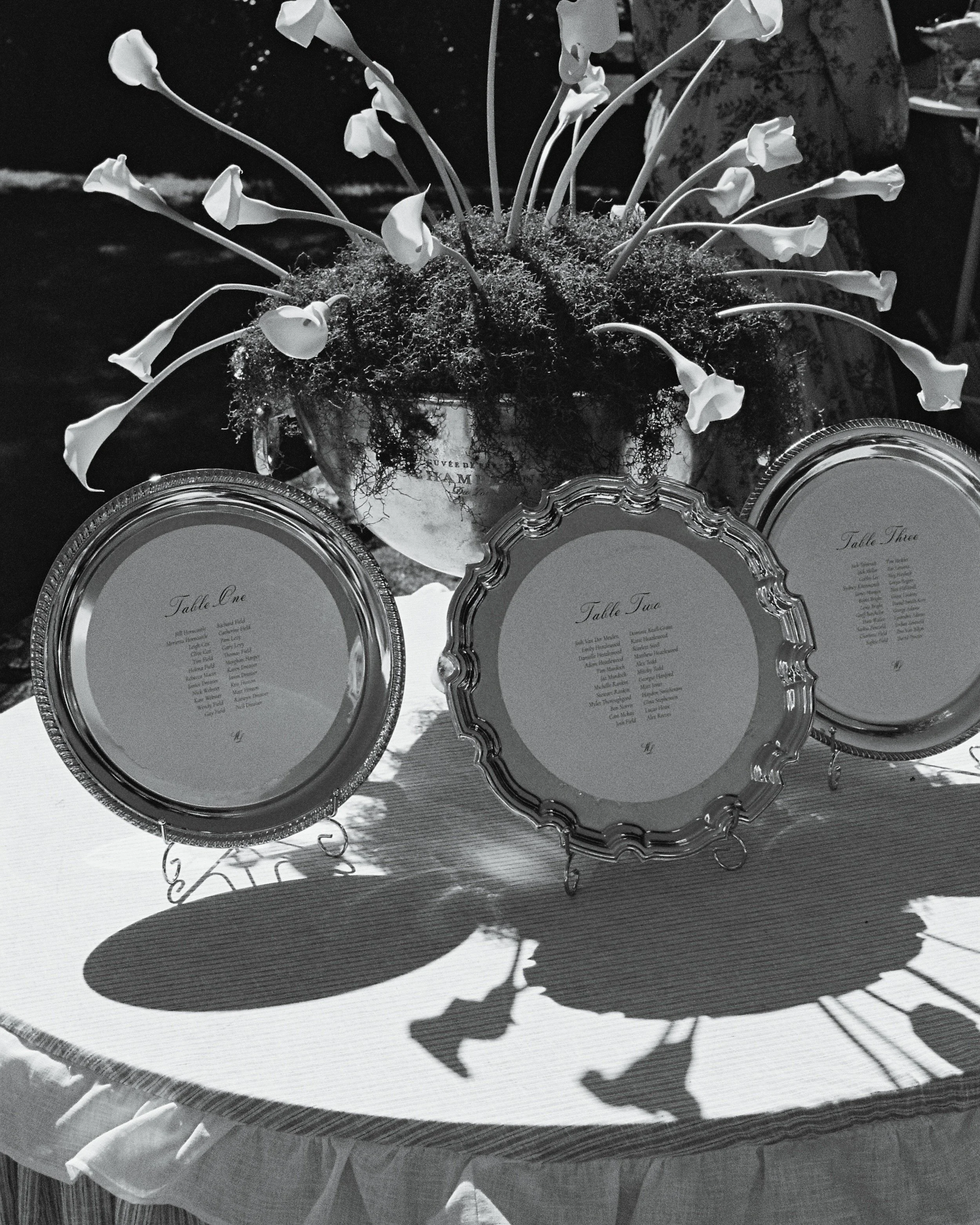 A seating chart that deserves its own post. For Laura, we designed bespoke decals for application across silver platters. Perfectly understated yet romantic, and it might just be the most effortless styling element we created this past season. 

Phot