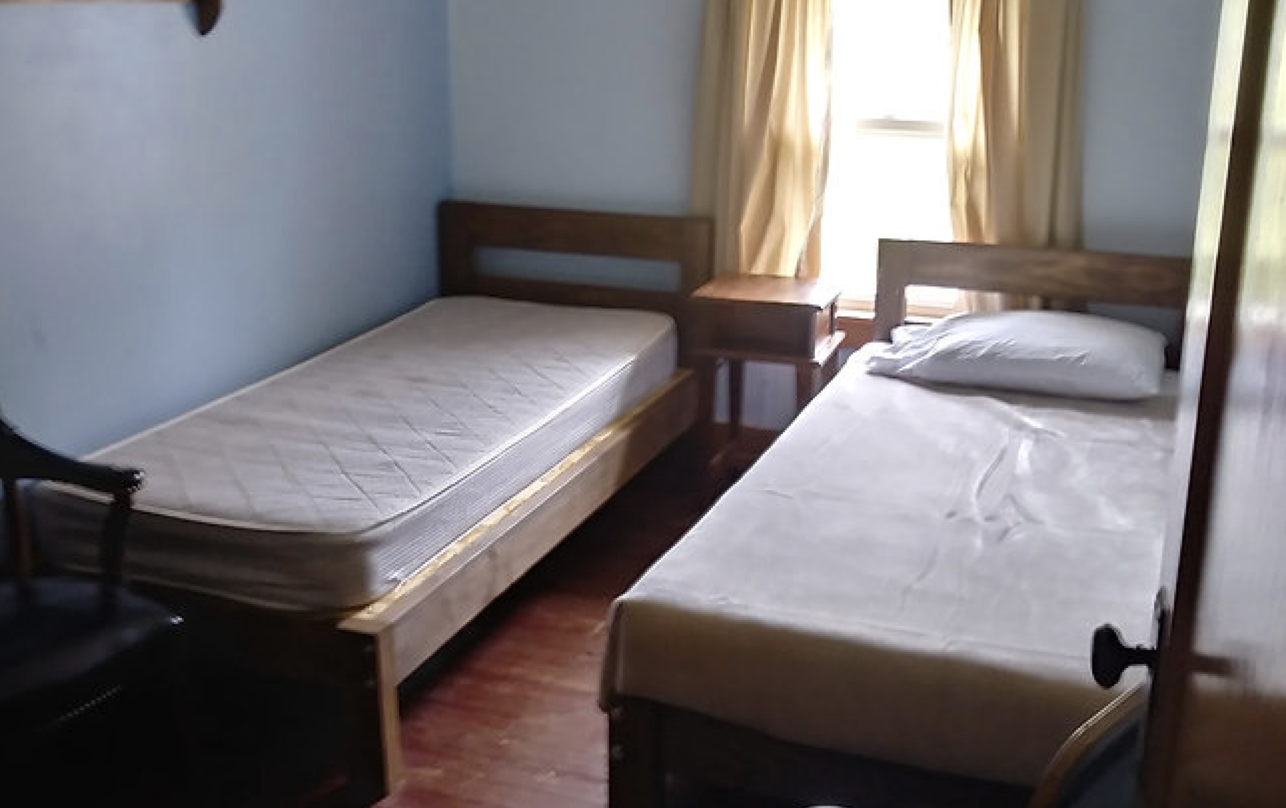 Upstairs room with 2 single beds