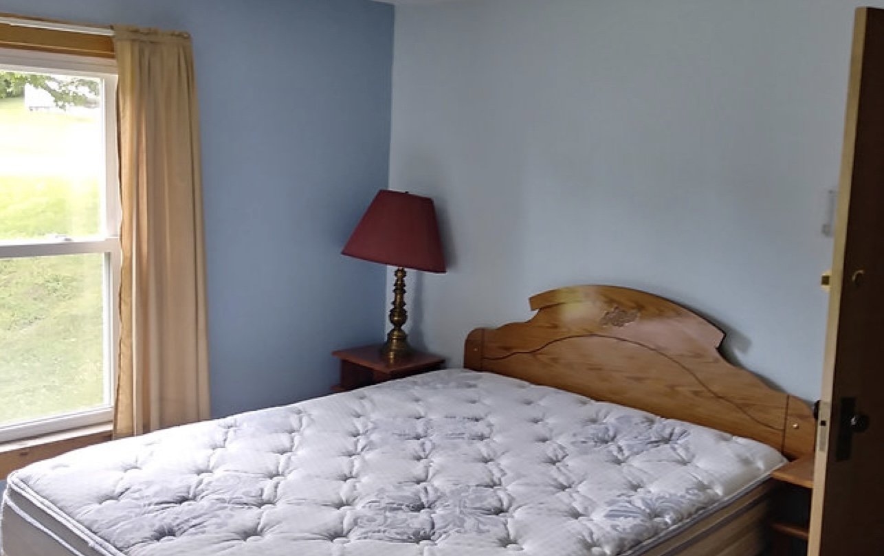 First floor suite-style room with one double bed and 2 single beds