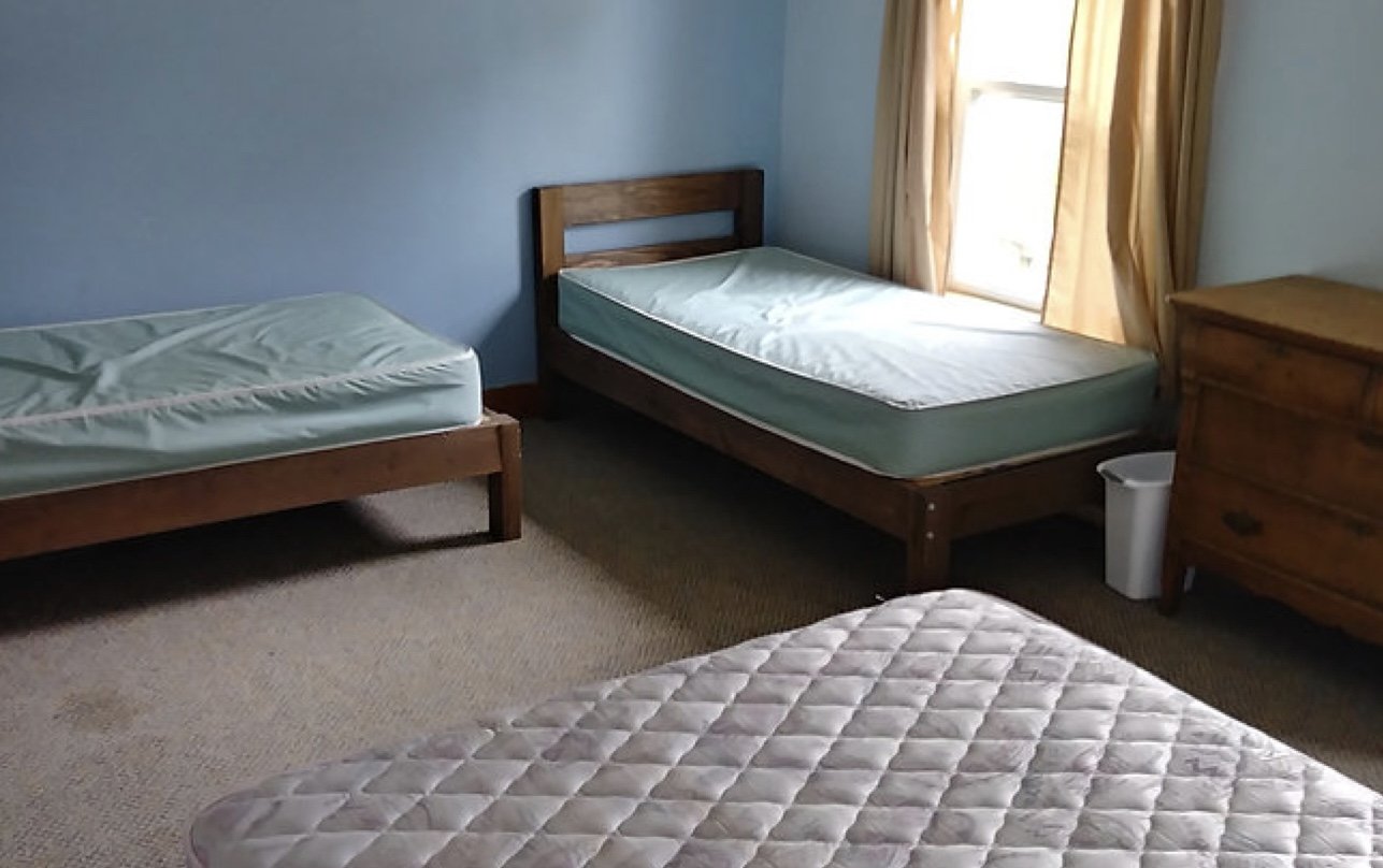 First floor suite-style room with one double bed and 2 single beds