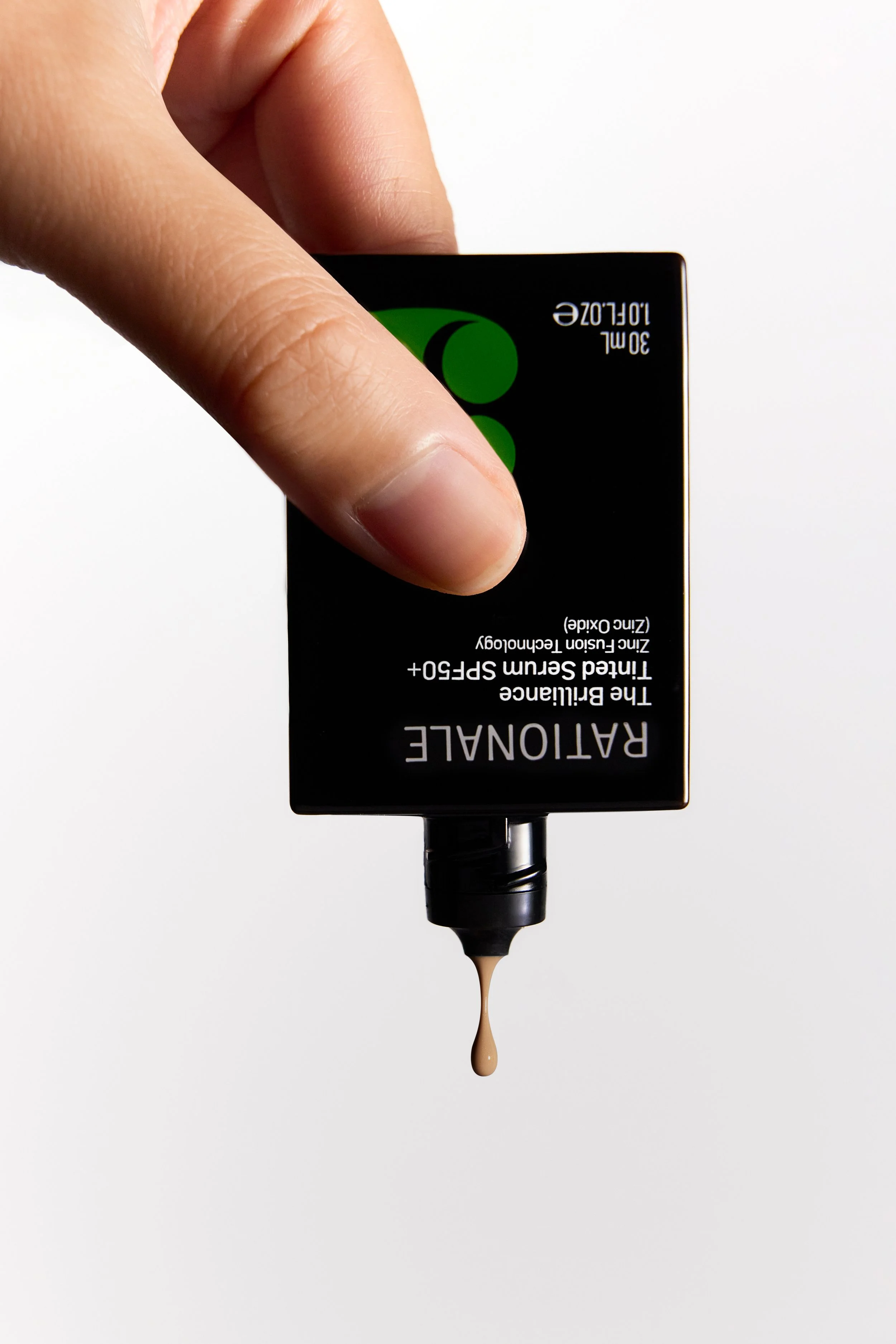 2_RATIONALE 3 Brilliance Tinted Serum_In Hand.jpg