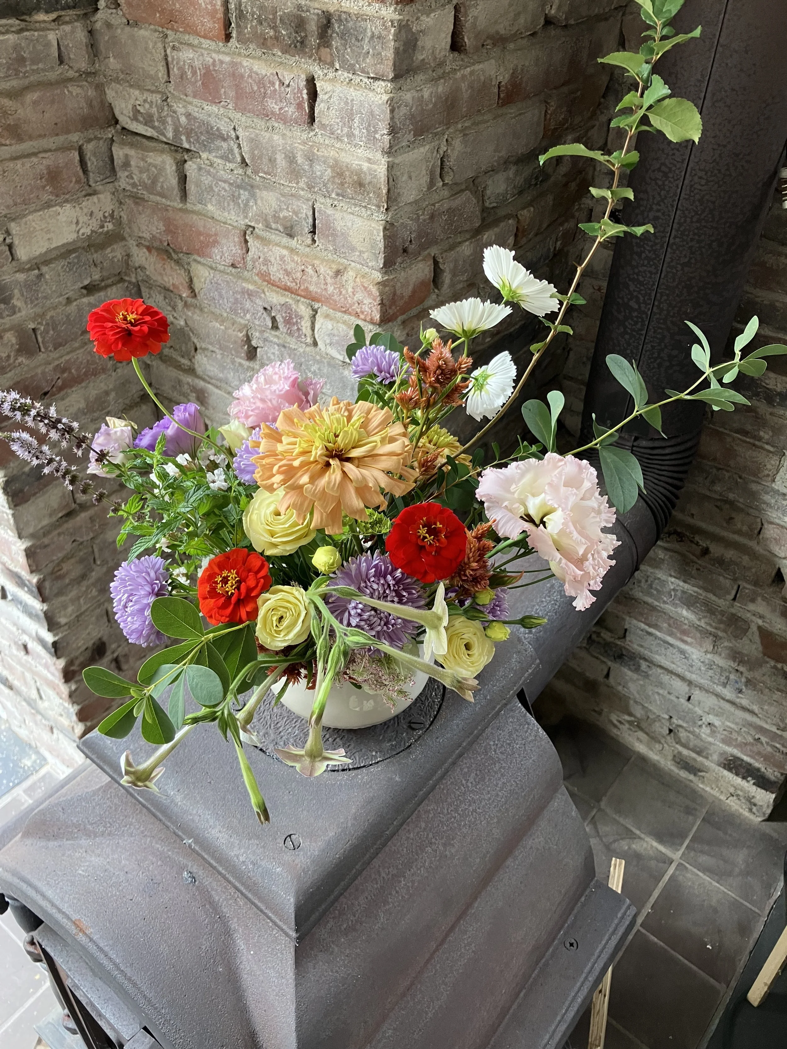 A bright and funky floral arrangement designed with locally grown flowers. 