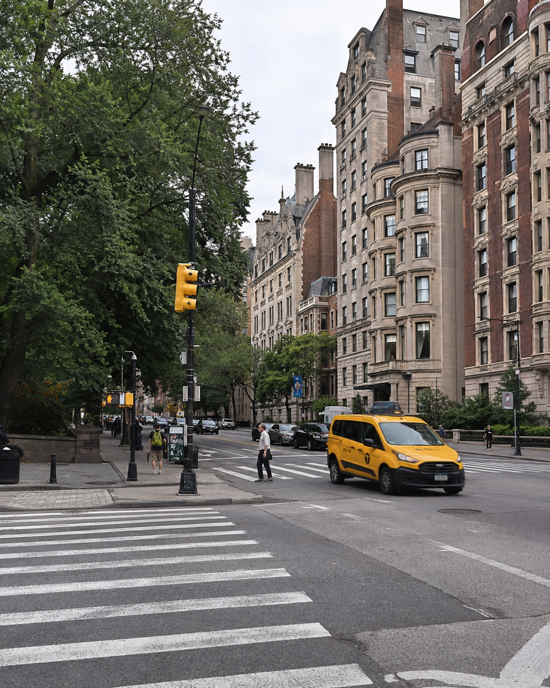 Crossing Central Park West on the Upper West Side, with prewar buildings and the park on the left