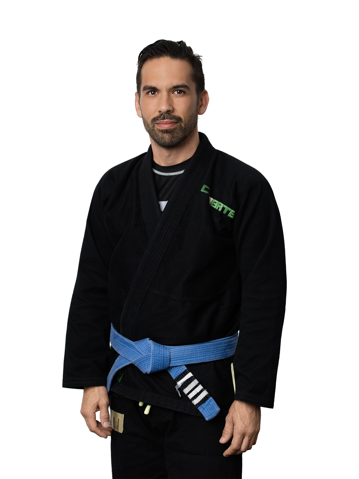 Man in a black Brazilian Jiu-Jitsu gi with a blue belt, standing confidently.