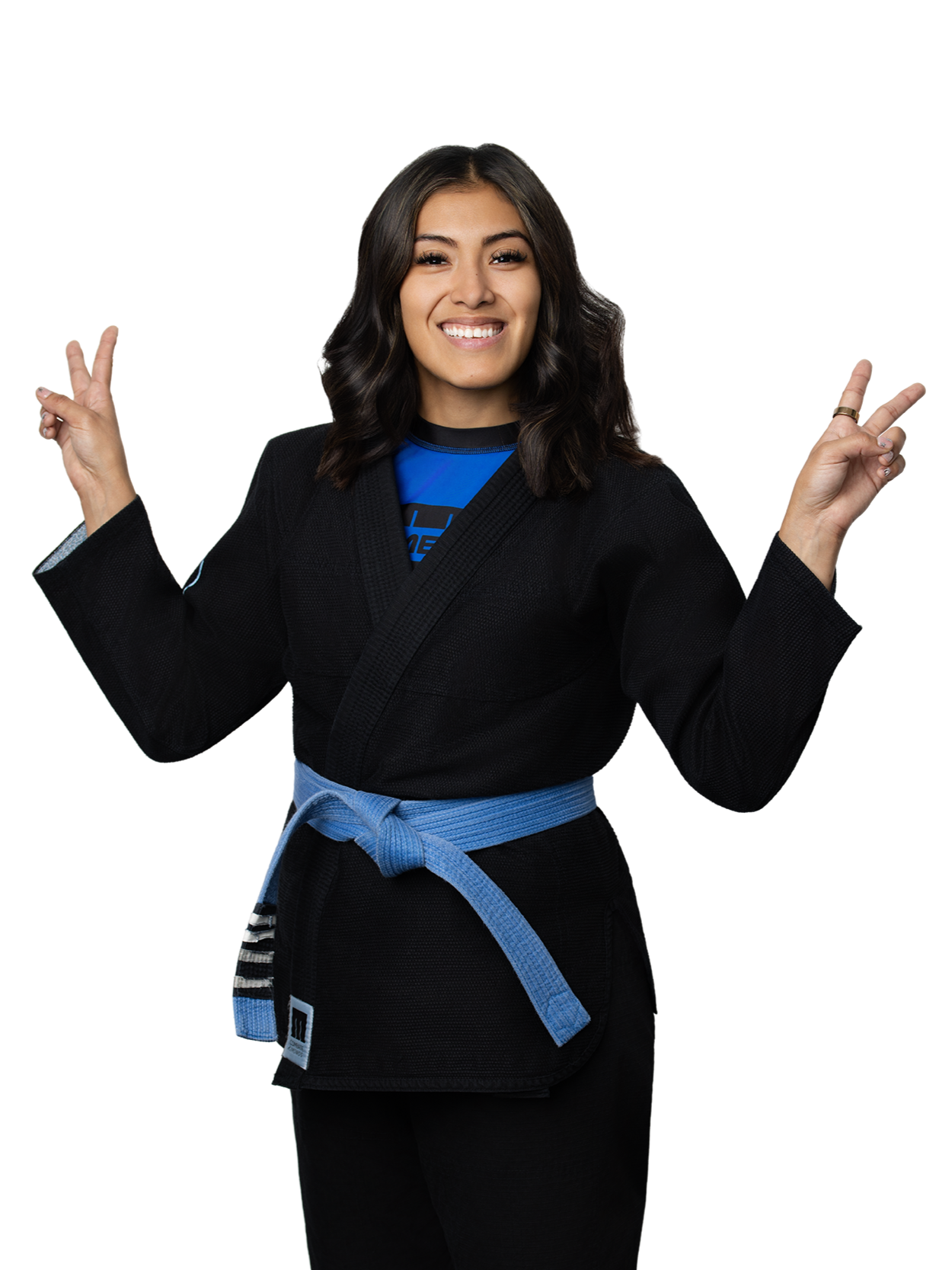 Young woman smiling, wearing a black martial arts gi with a blue belt, holding up both peace signs with her fingers.