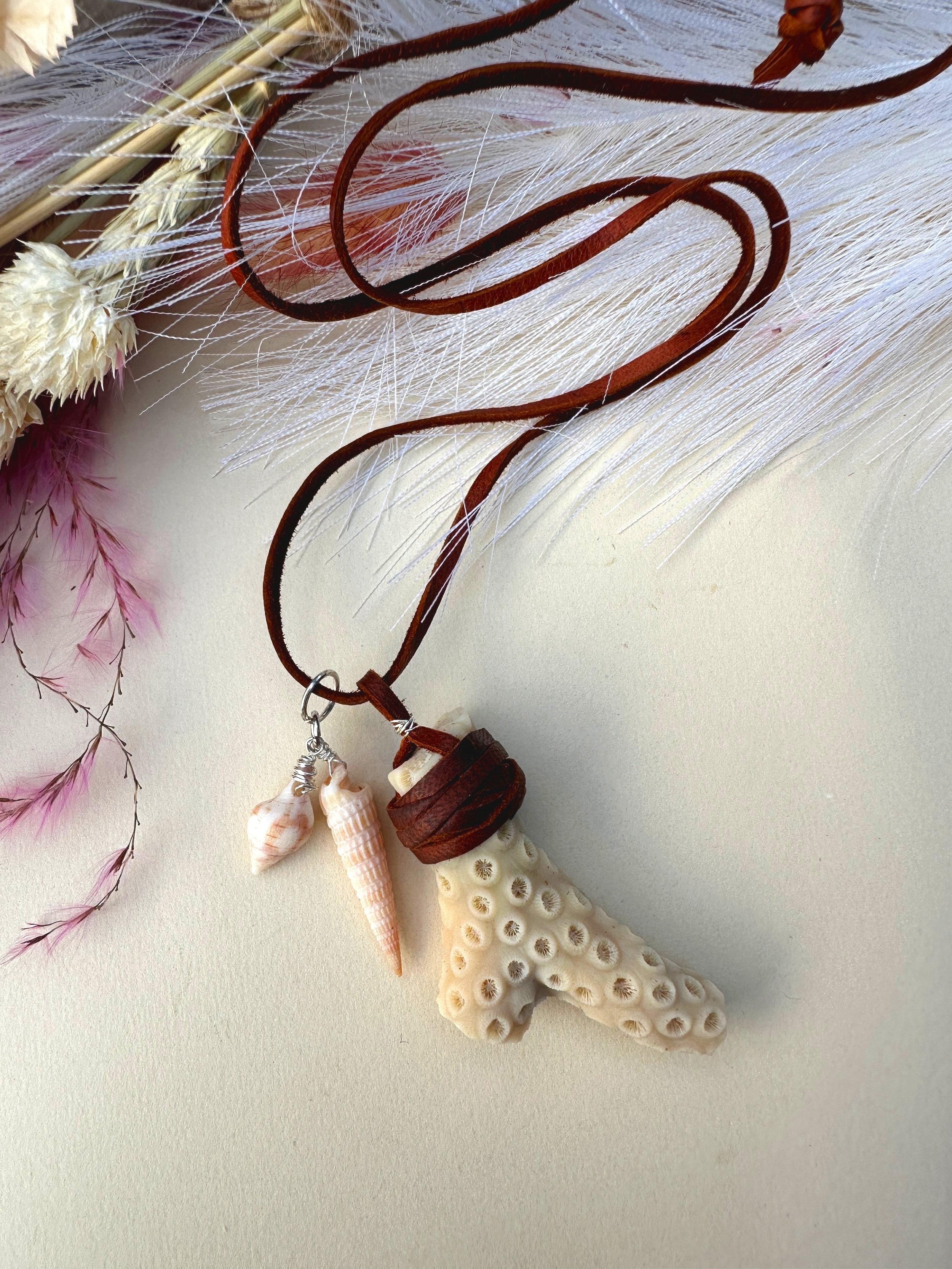 Brown deer skin lace suede leather cord necklace with coral branch pendant and auger and tulip shell pendants.