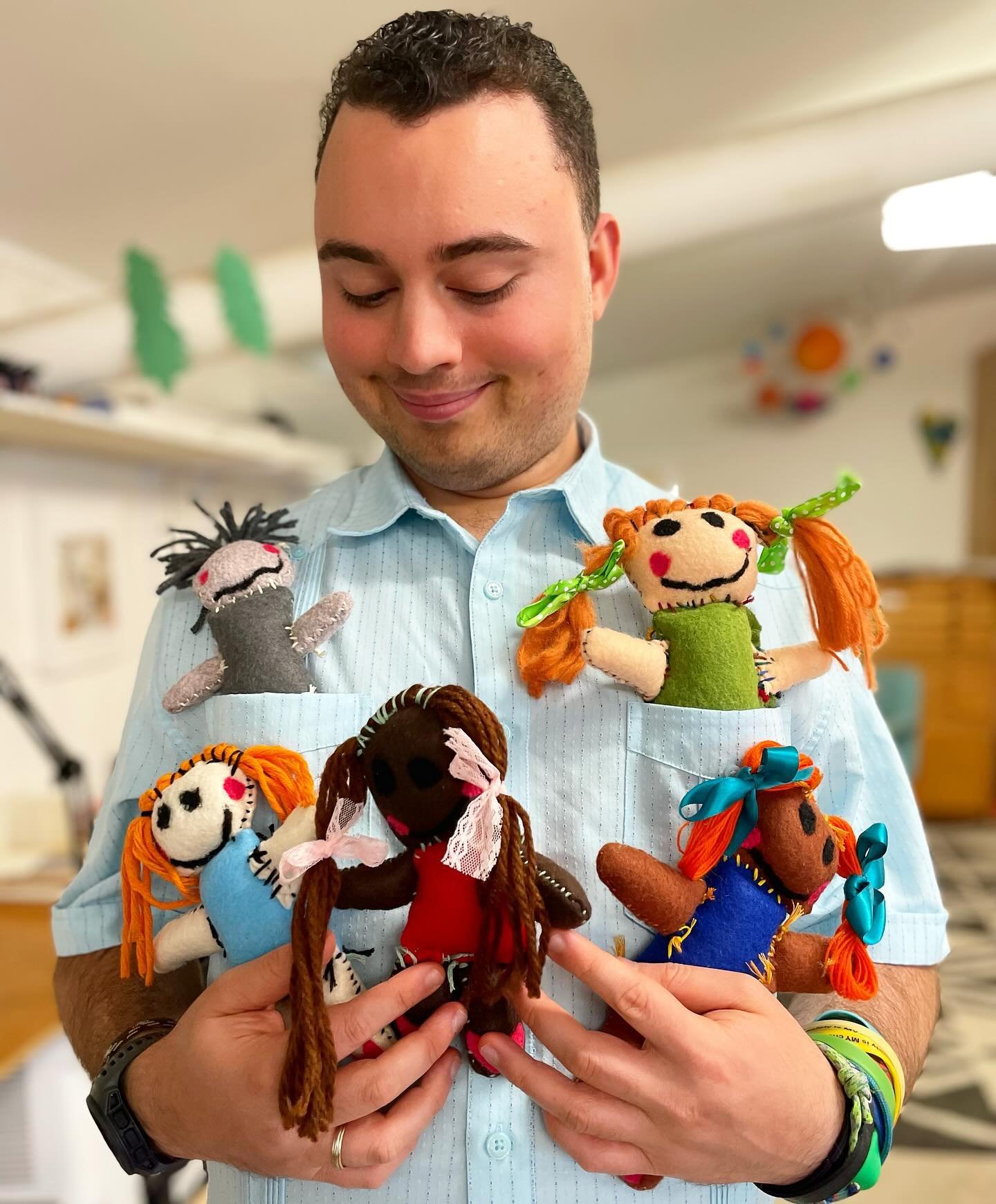 Wishing y&rsquo;all a Monday as sweet as this new troop of original Davis Wohlford dolls. 
.
.
.
Image description: Davis wears a blue colored shirt and holds 5 handmade dolls, 2 of which are in his shirt pockets.