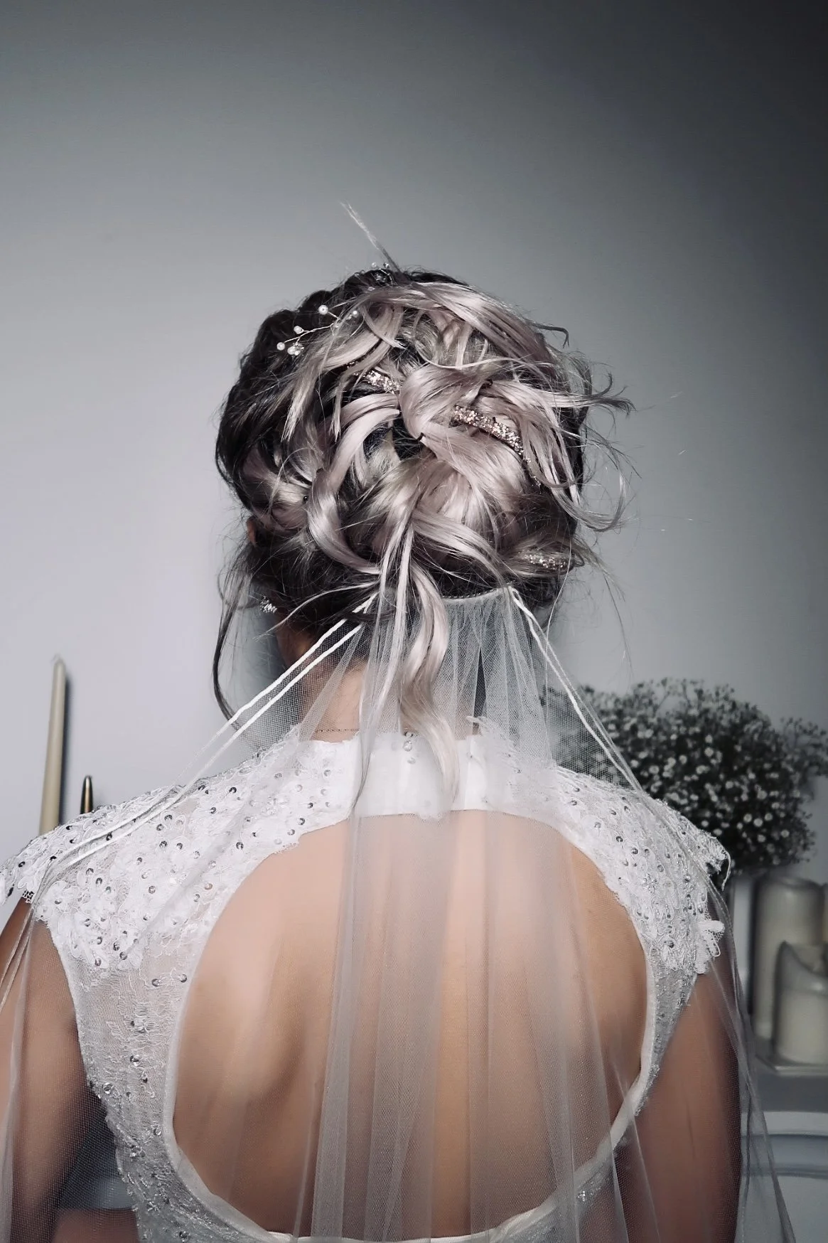 Bride with intricate braided hairstyle and veil