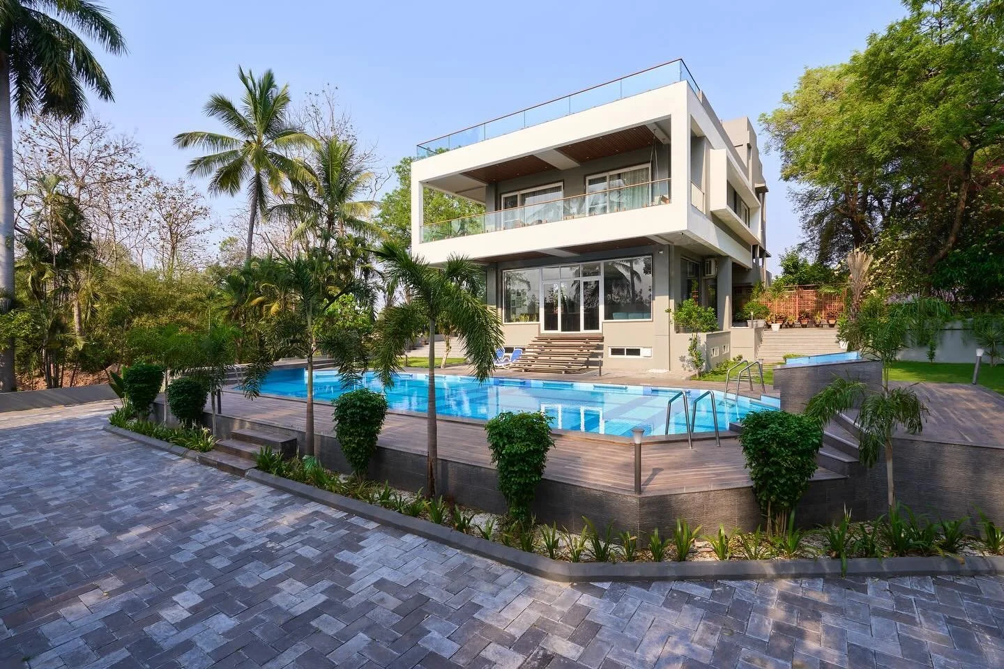 Luxurious farmhouse designed with an elegant, minimalist approach to enhance the surrounding landscape. 
Architectural design and planning, landscape and site development, and interior design by @sunilnagalassociates 

Project Photography by @ashishb